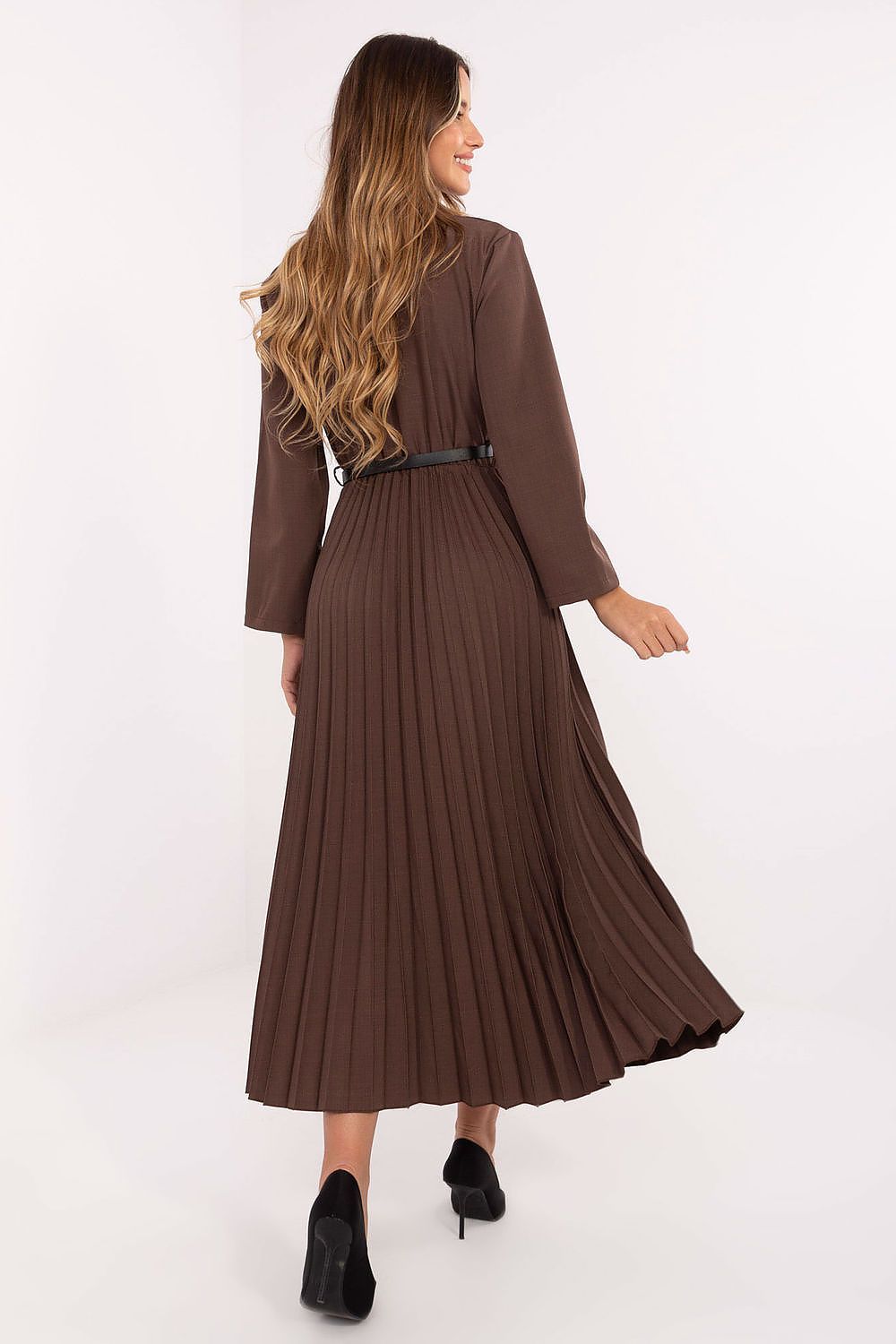 Back view of women’s long sleeve maxi dress with smooth finish and flowing pleats