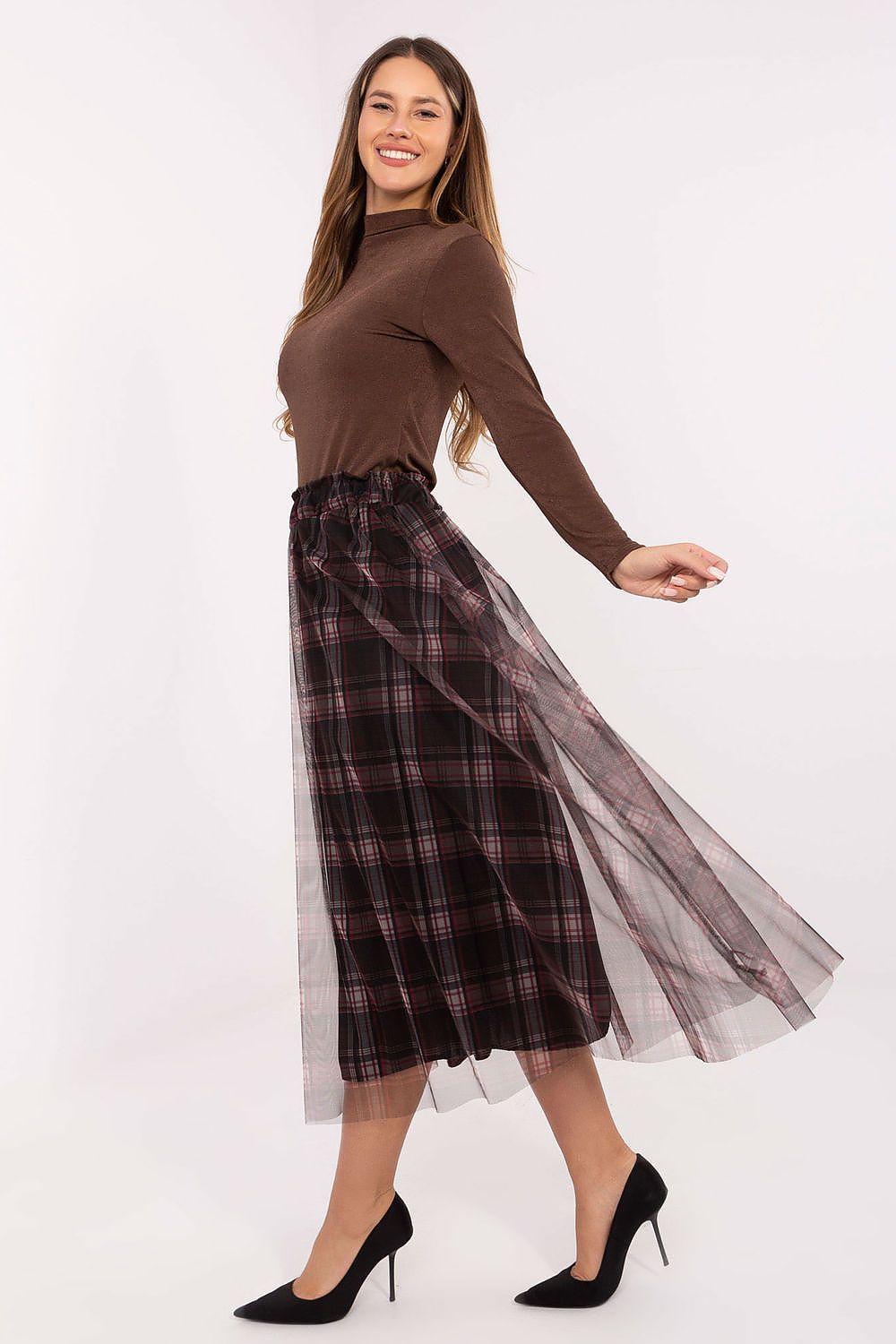 Side view of tulle skirt showing layered fabric and flowy movement in black