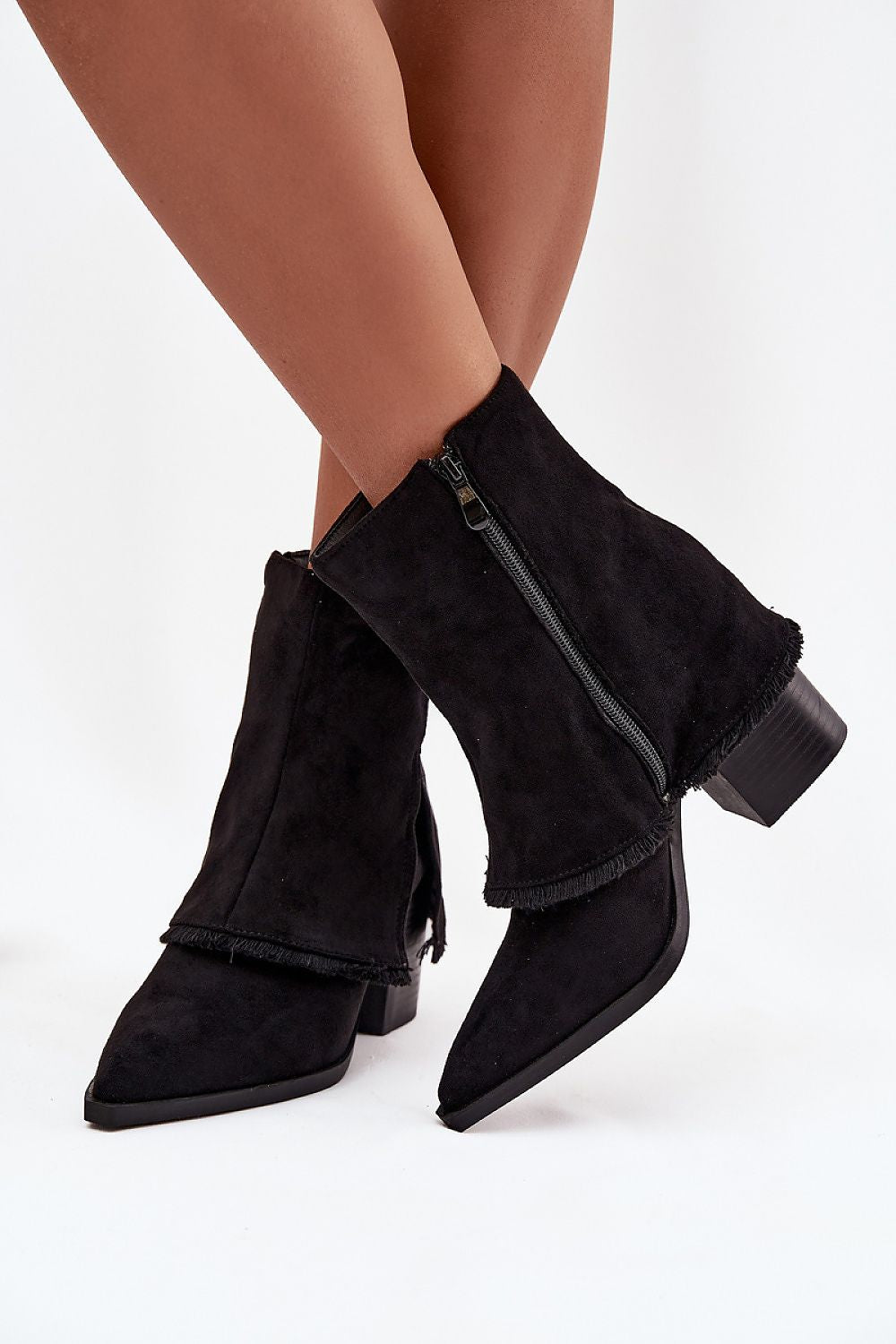 Side view of stylish ankle boots with rolled upper and zipper closure.