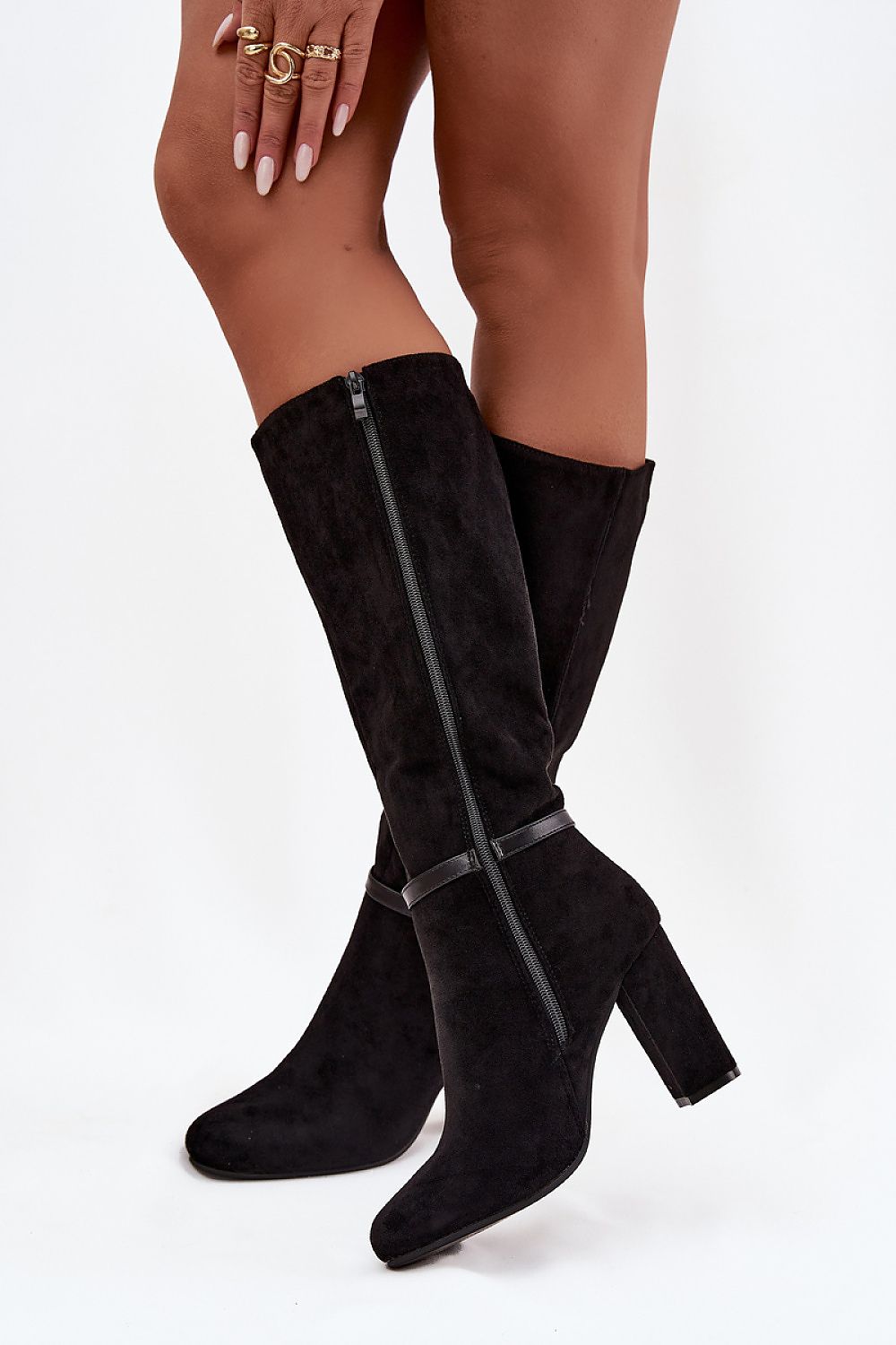 Side view of elegant eco suede boots with a gold buckle strap and column heel.