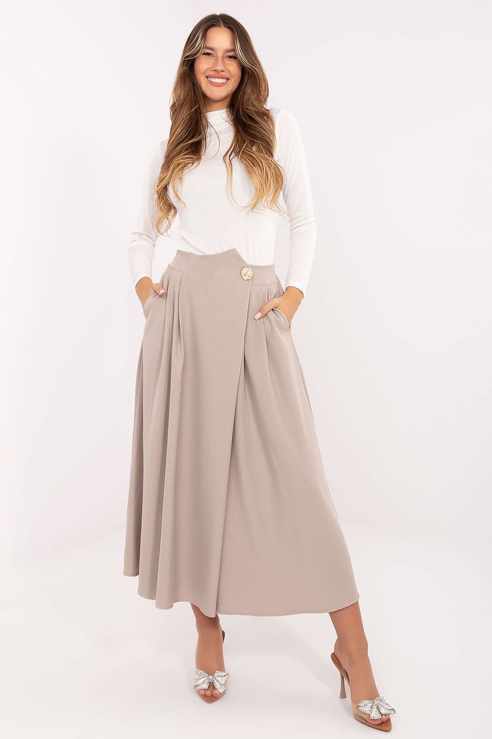 Elegant pleated midi skirt with side pockets – front view in beige