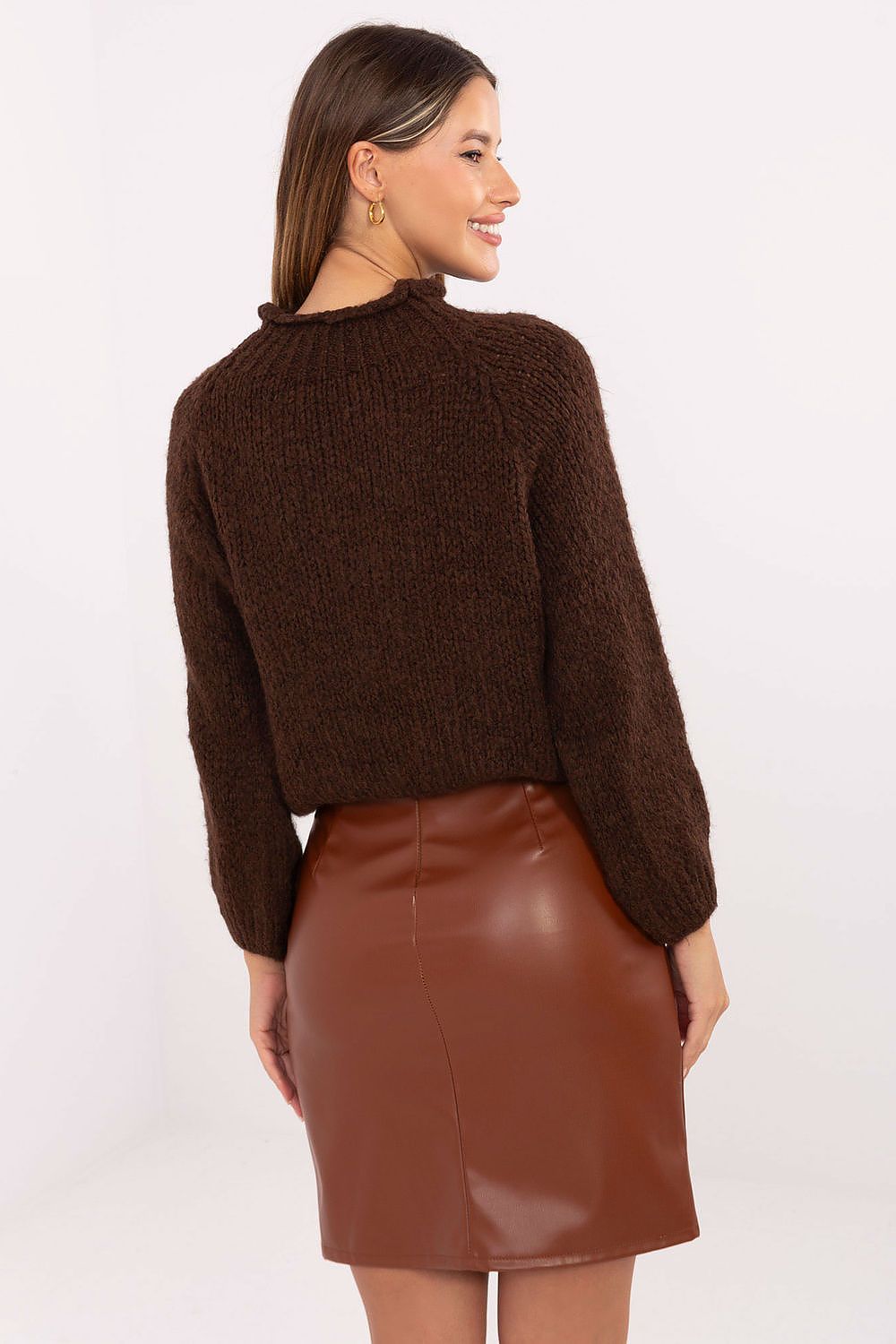 Stylish eco-leather mini skirt showcasing smooth texture and feminine silhouette – back view.