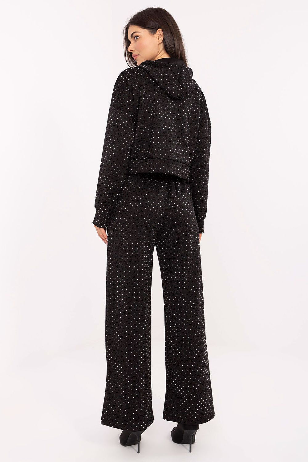 Back view of the elegant tracksuit showing the relaxed, flattering fit in black
