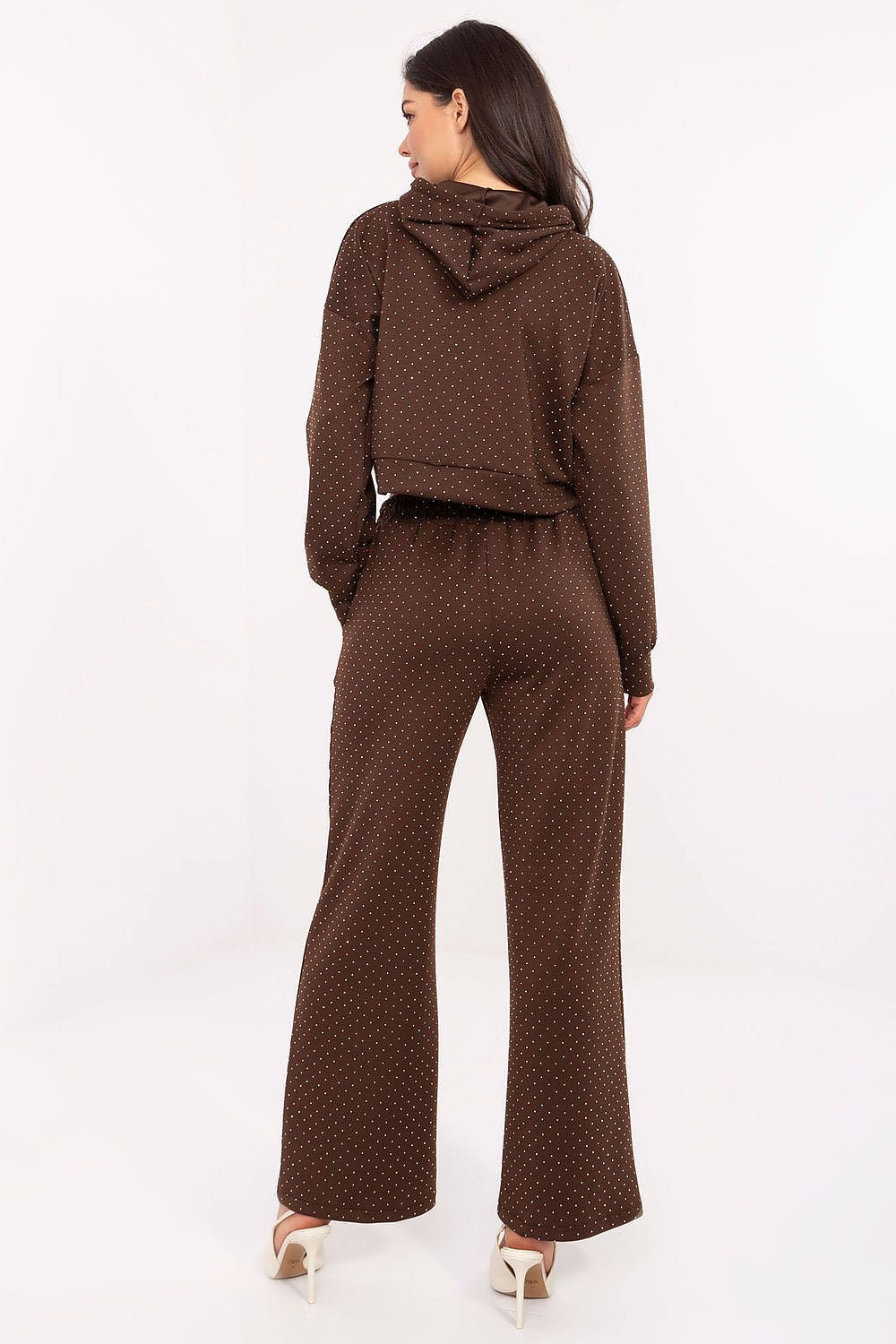 Back view of the elegant tracksuit showing the relaxed, flattering fit.