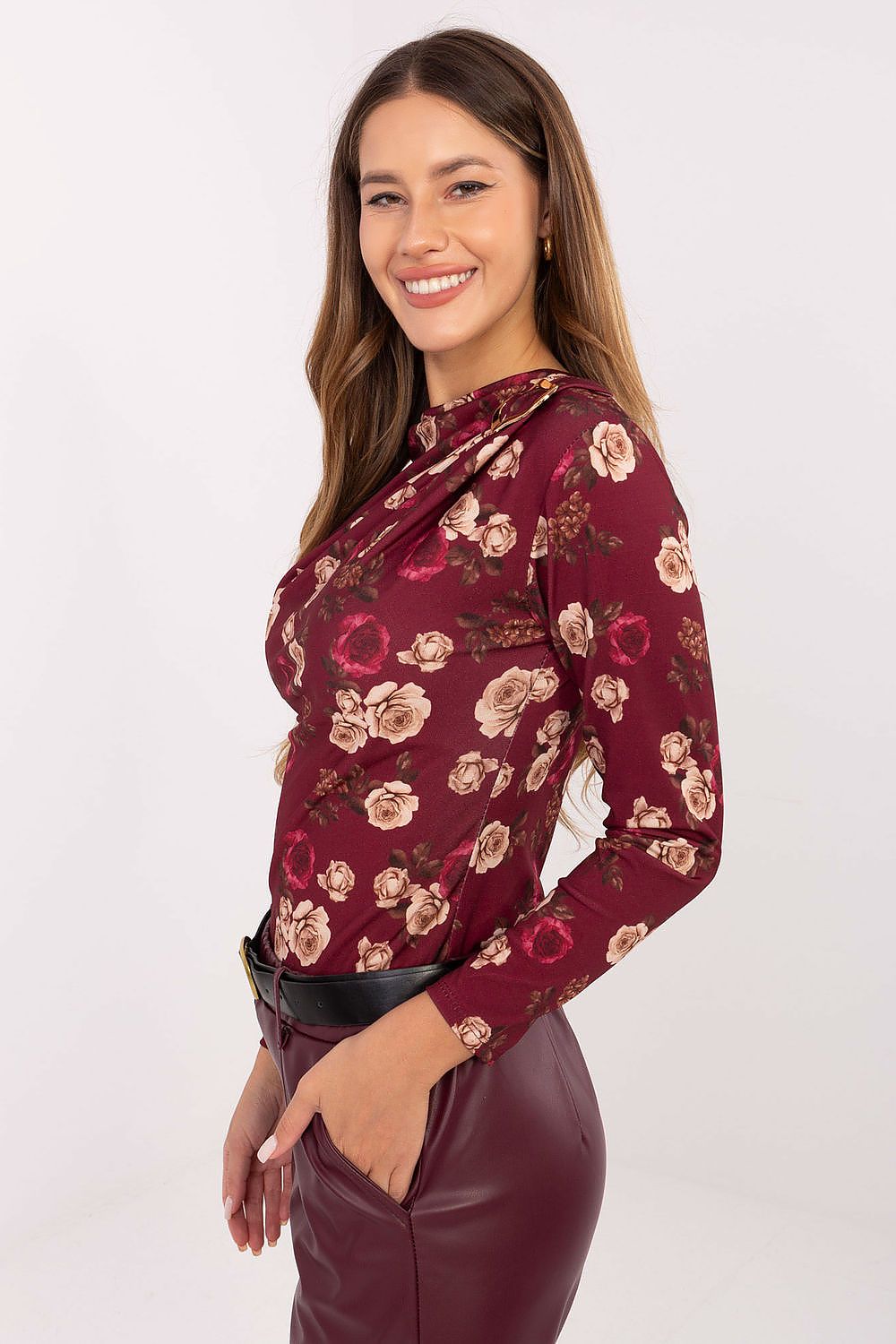 Red fitted floral blouse highlighting ruching detail – side view.