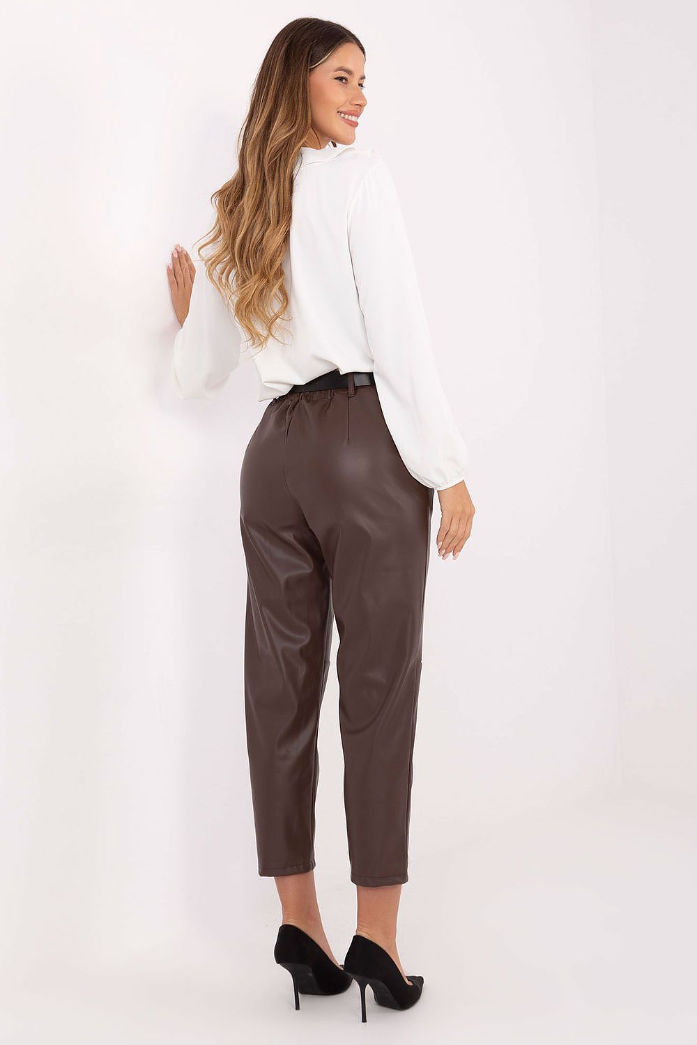 Brown insulated leatherette pants with elastic waistband and pockets – back view.