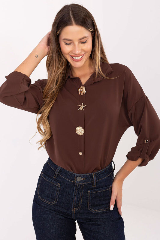 Classic shirt front view showcasing elegant brooch details and button-down design.