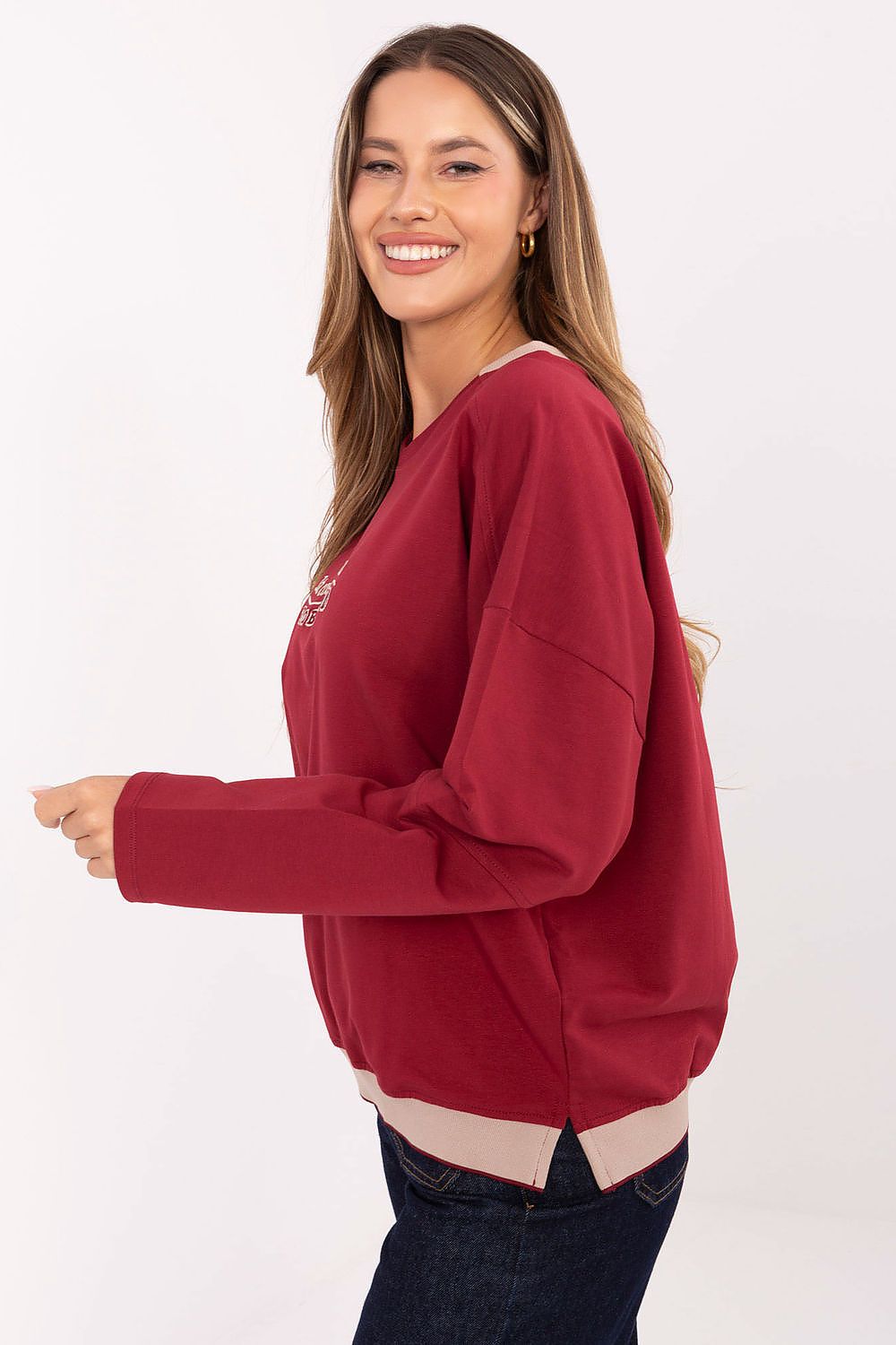 Woman wearing a red sweater on a white background