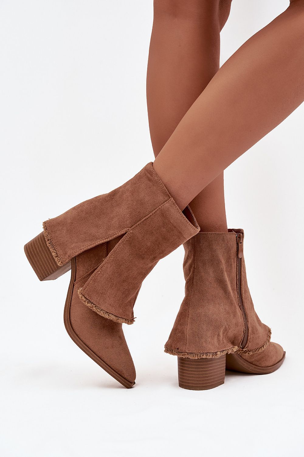 Side view of light brown eco-suede ankle boots showing pointed toes