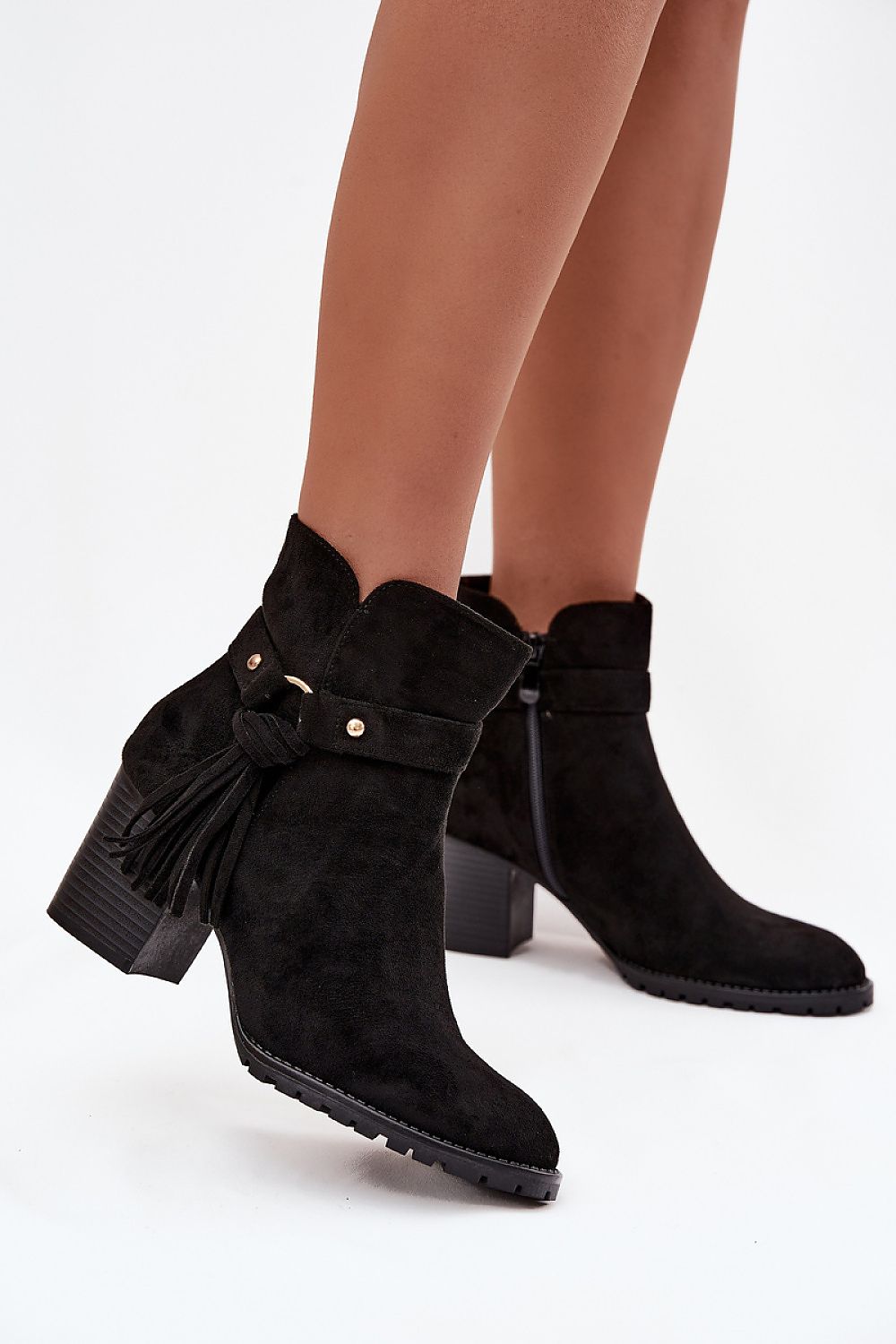 Black eco-suede ankle boots with fringe strap and column heel