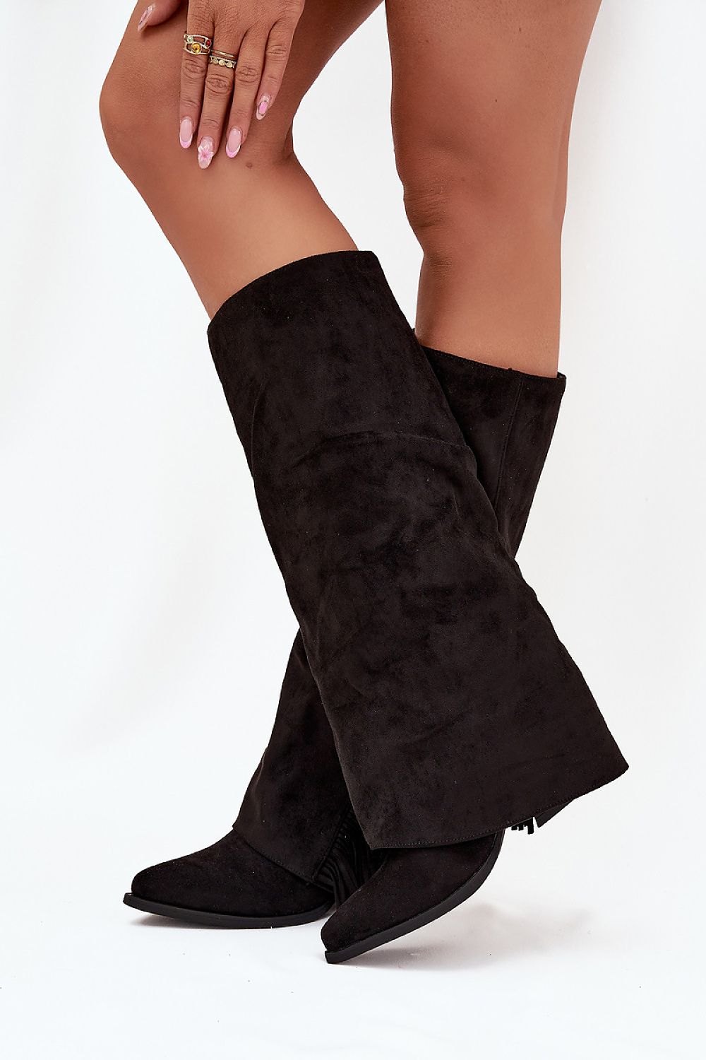  Side view of slip-on cowboy boots with pointed toe and boho fringe