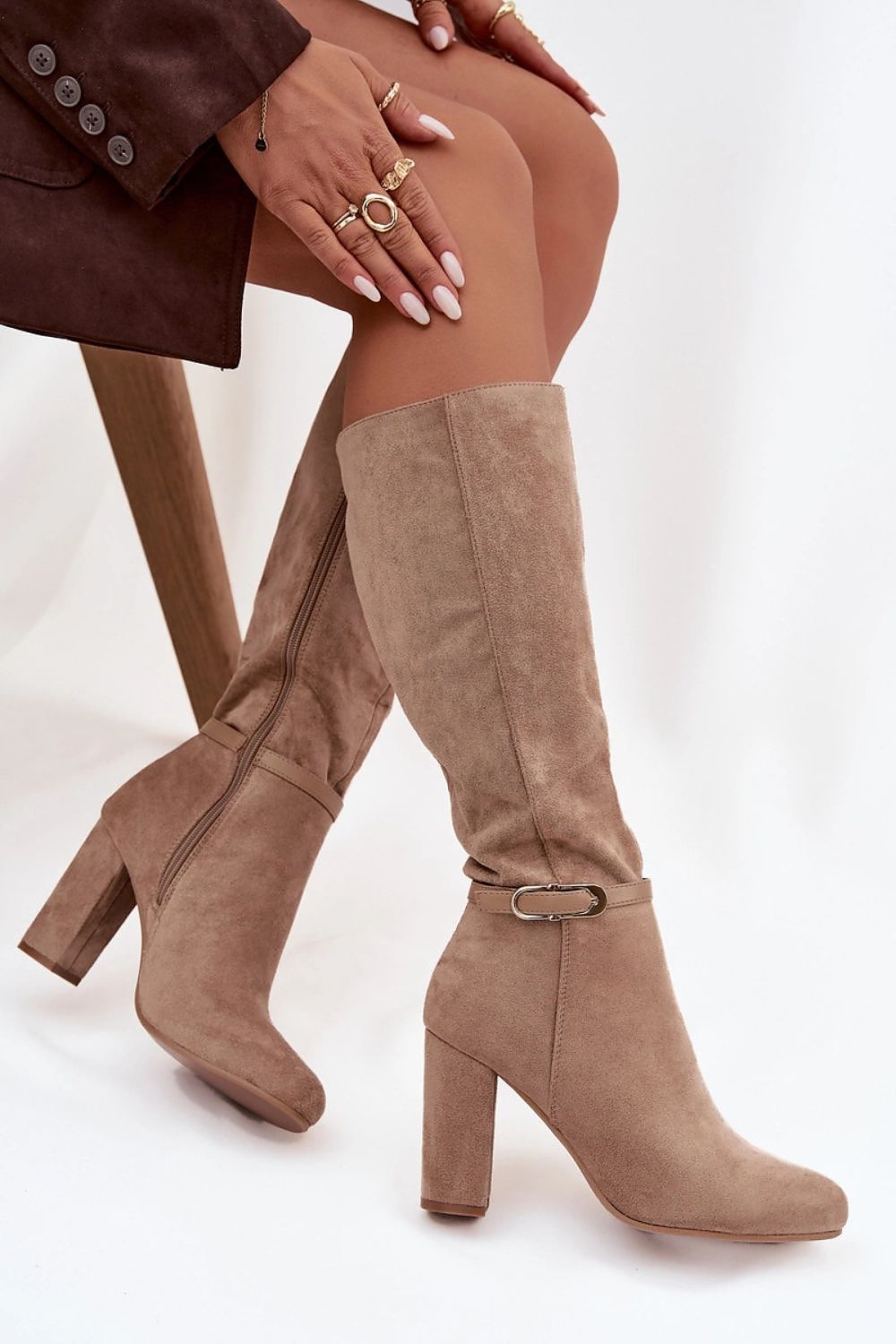 Side view of heeled eco-suede boots with rounded toes