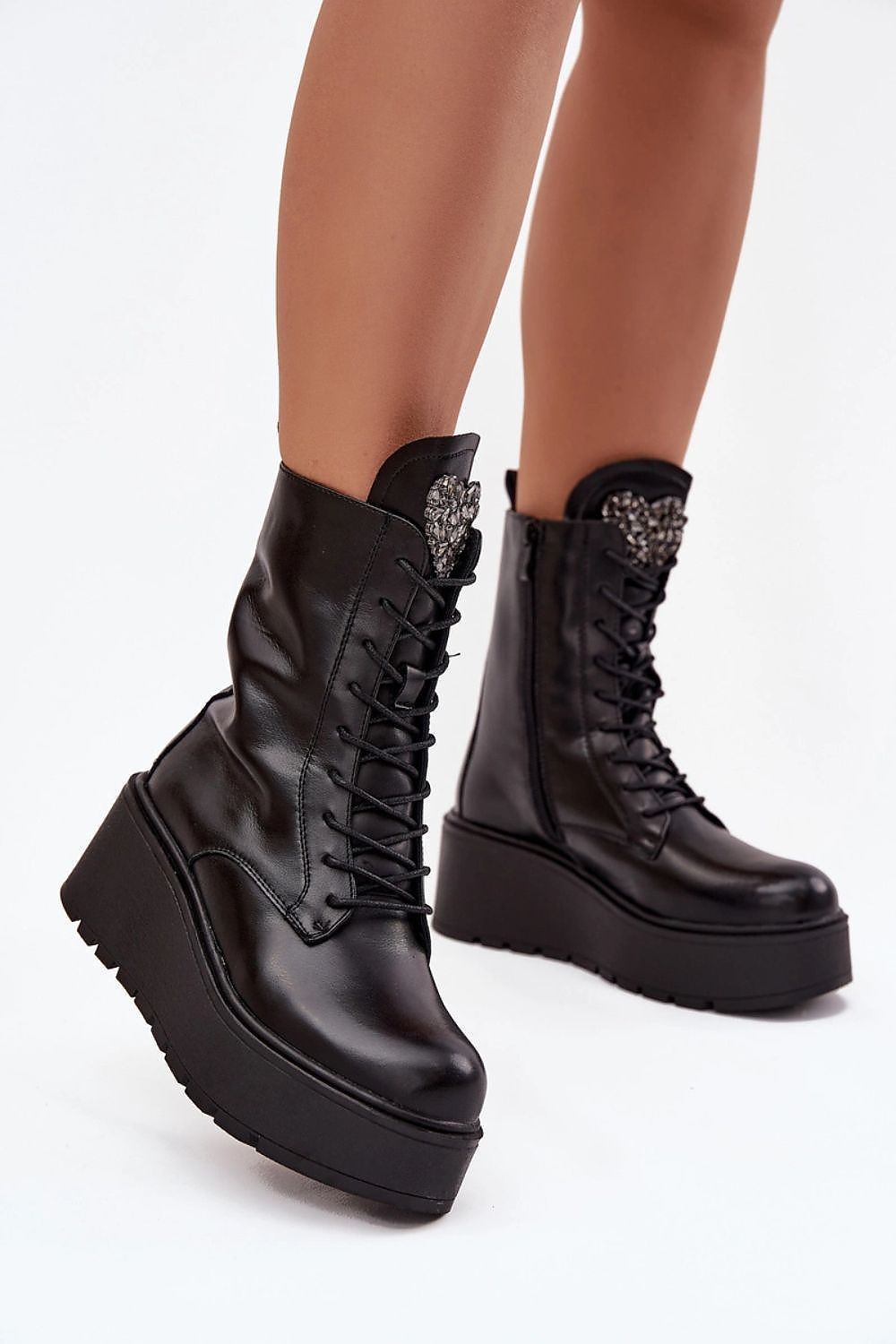 Black natural leather wedge boots with crystal heart detail on tongue