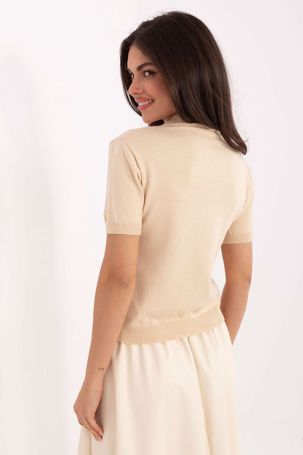 Back view of beige heart print sweater, casual style.