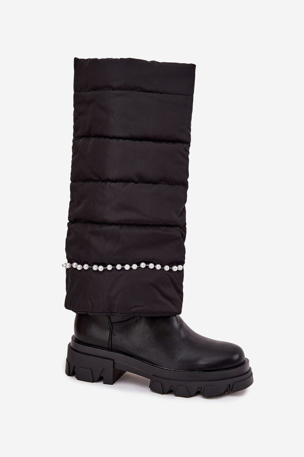 Close-up of bead detailing and soft textile upper of women’s slip-on boots in black