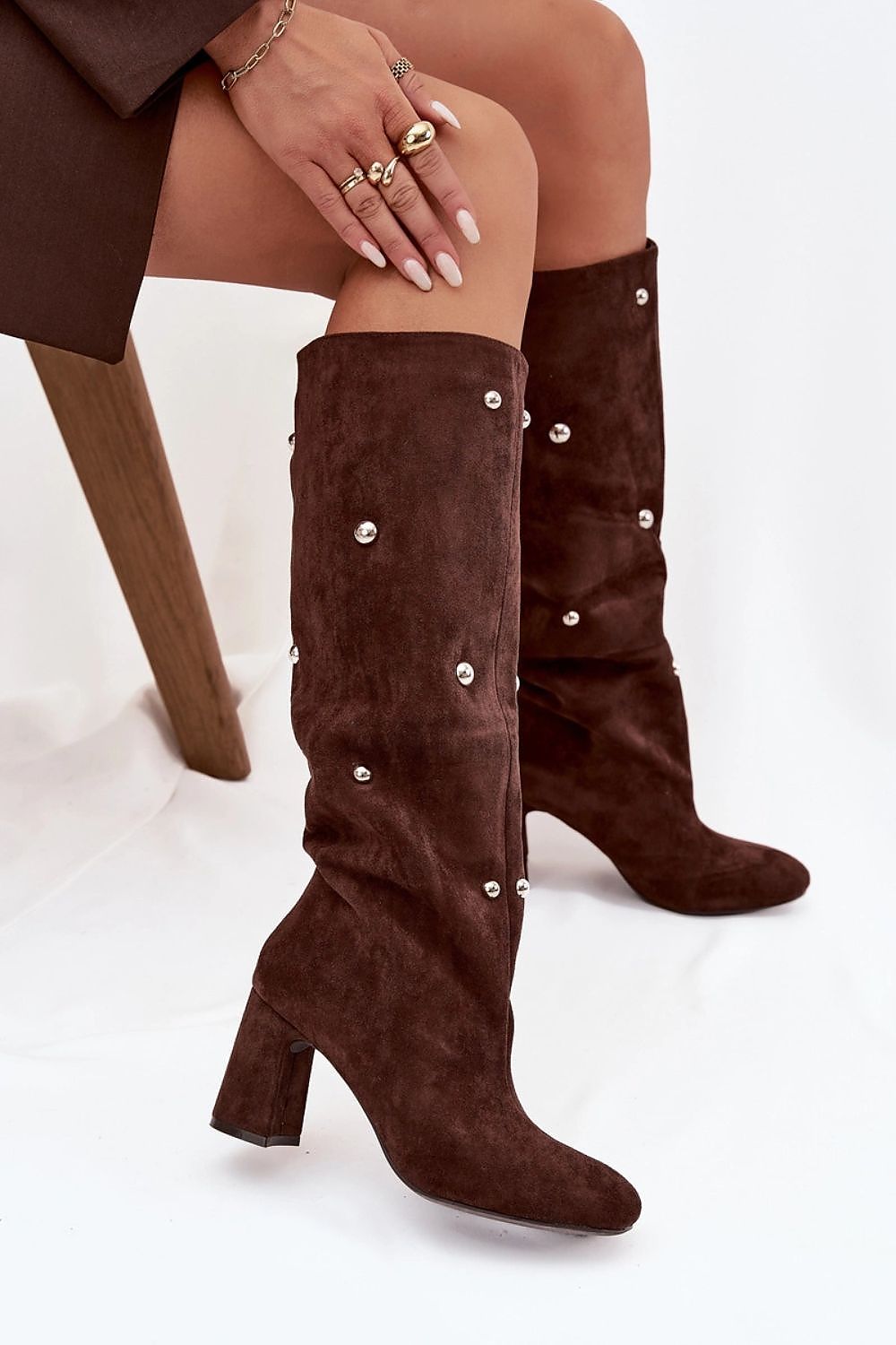 Women's faux suede column heel boots — side view showcasing decorative details.