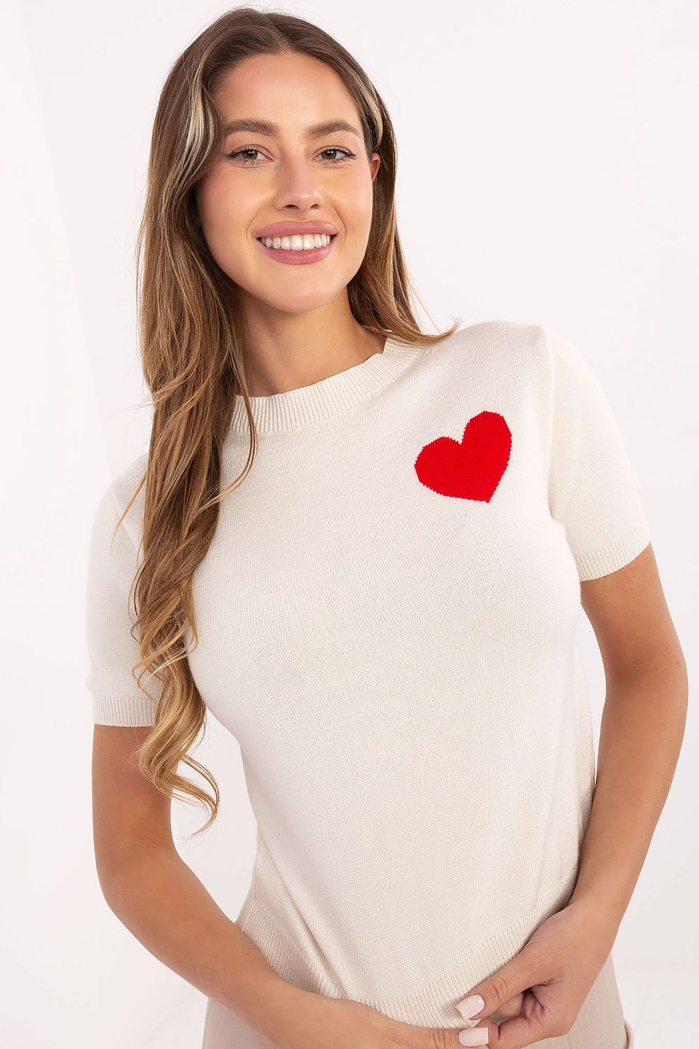 Light beige short sleeve sweater with heart design, front angle.