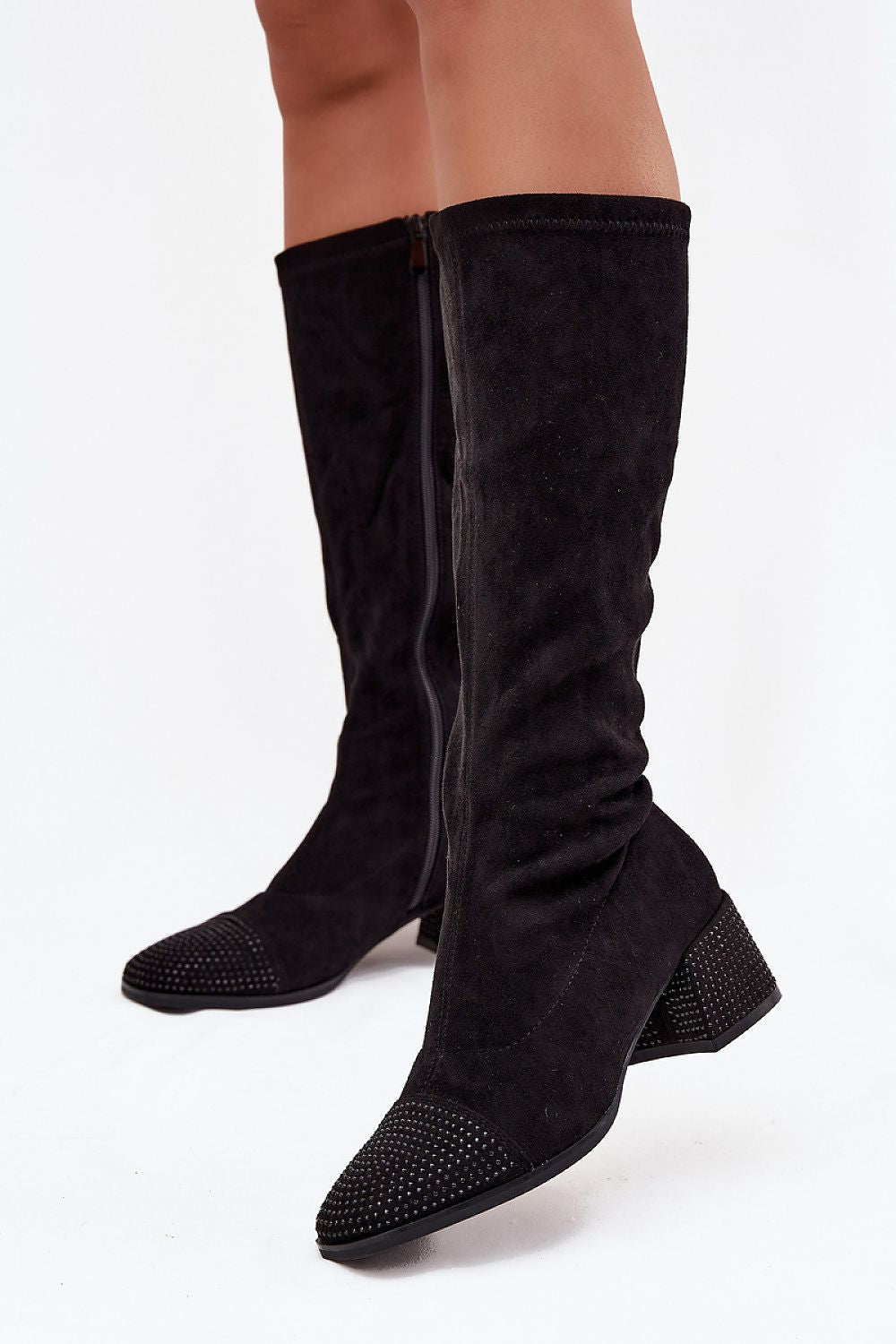 Front view of eco suede rhinestone block heel boots showing sparkling heel and delicate front details in black
