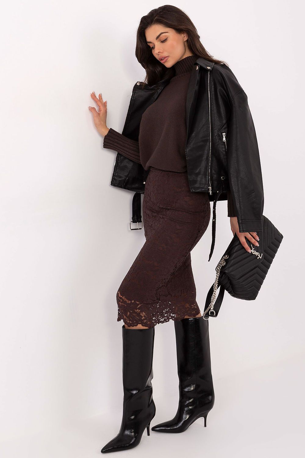 Side view of lace midi skirt showing soft lining and graceful knee-length finish.