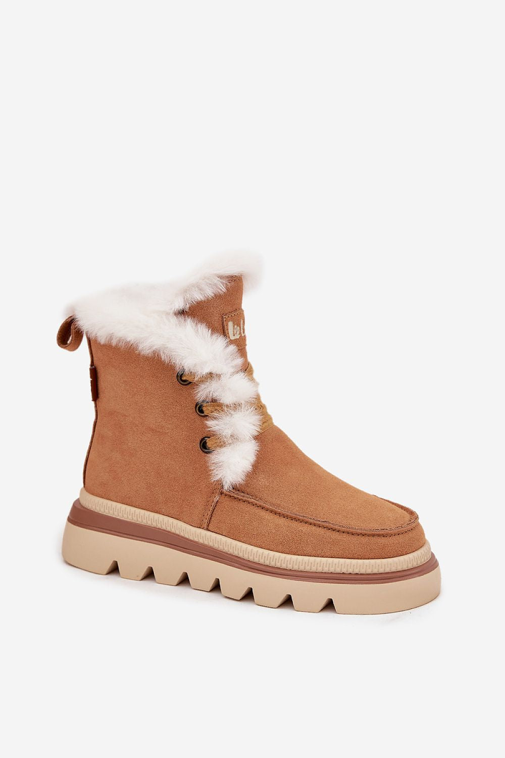 Tan winter boot with white fur trim on a white background