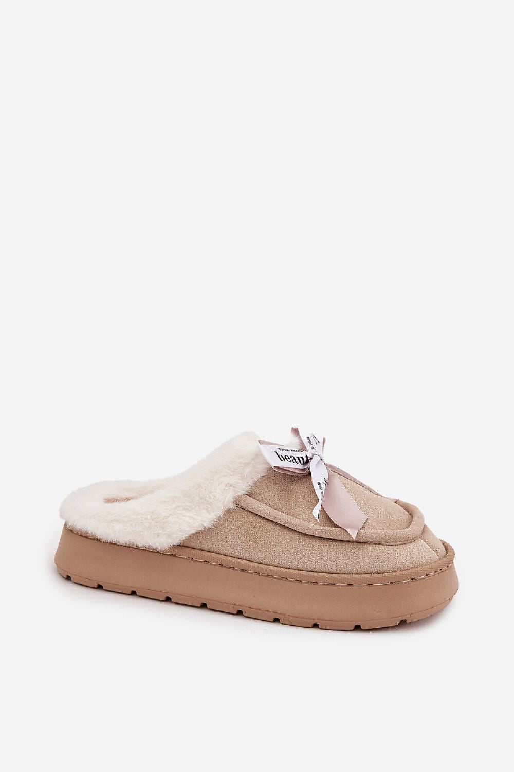 Beige slipper with white fur lining on a white background