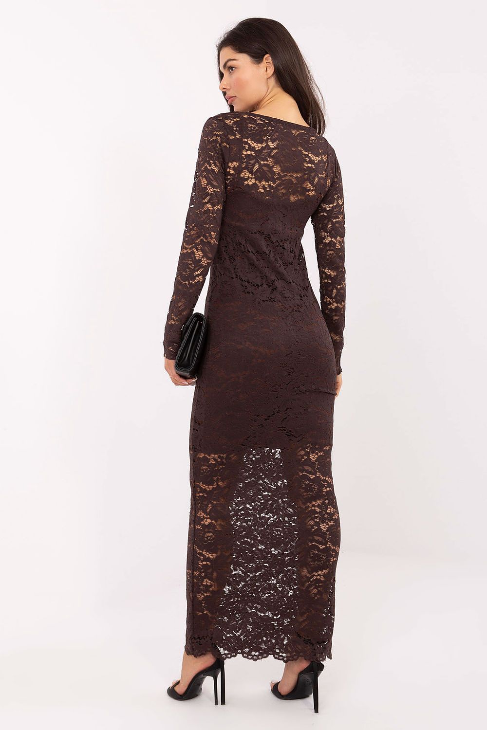 Woman wearing a brown lace dress on a white background