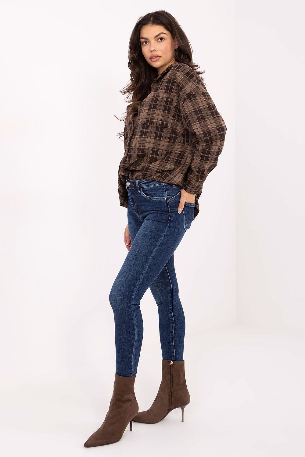 Close-up of medium waist and push-up detail on skinny jeans.
