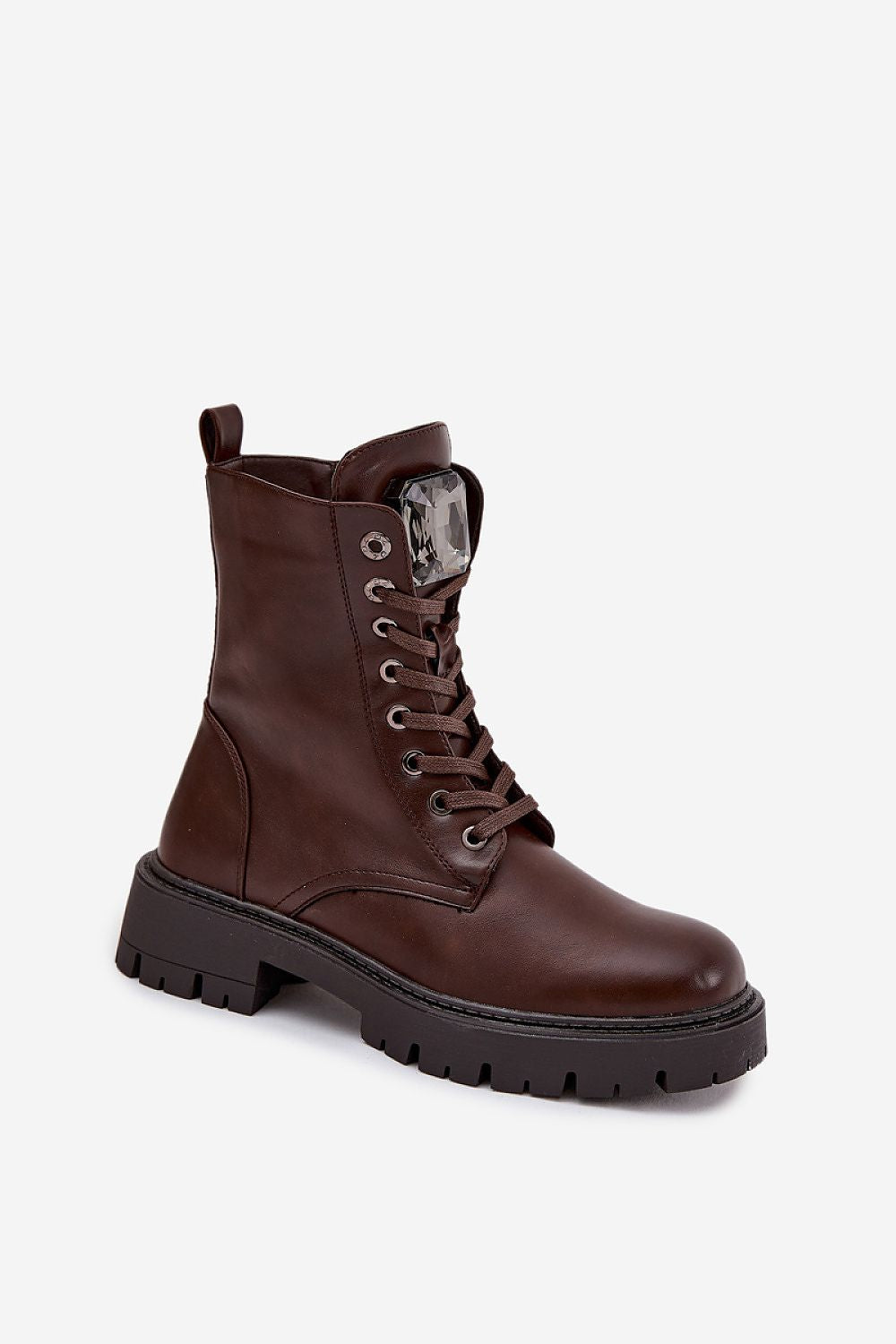 Brown leather boot with a thick sole on a white background