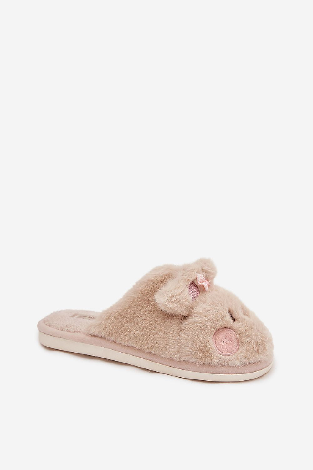 Pink fuzzy slippers with a heart design on a white background