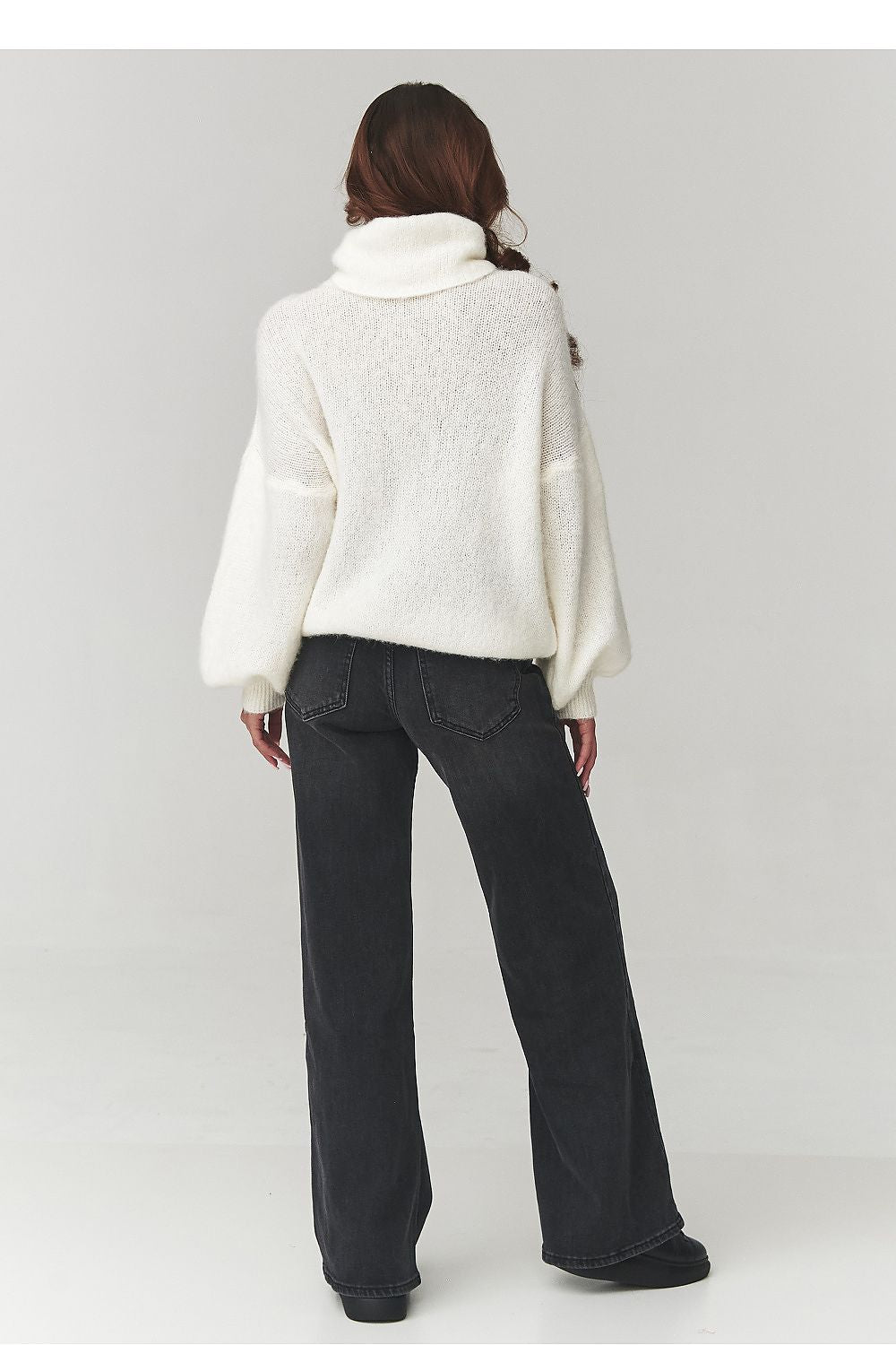  Women's beige oversized roll-neck sweater styled for autumn-winter