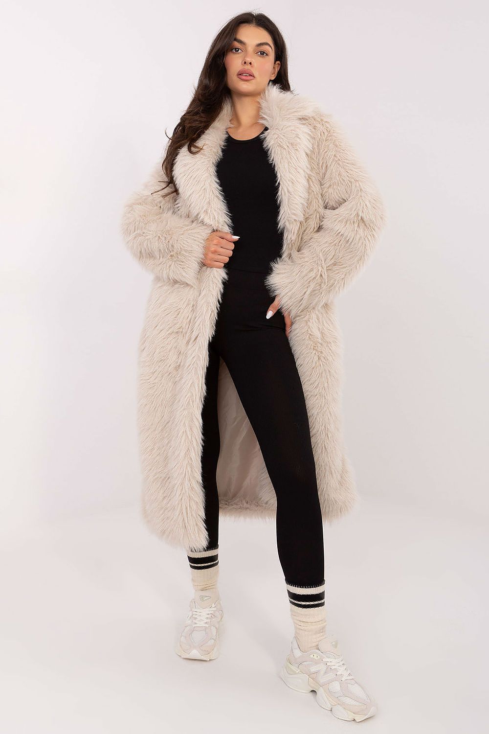 view of beige fur-trimmed coat showing snap closure and pockets.