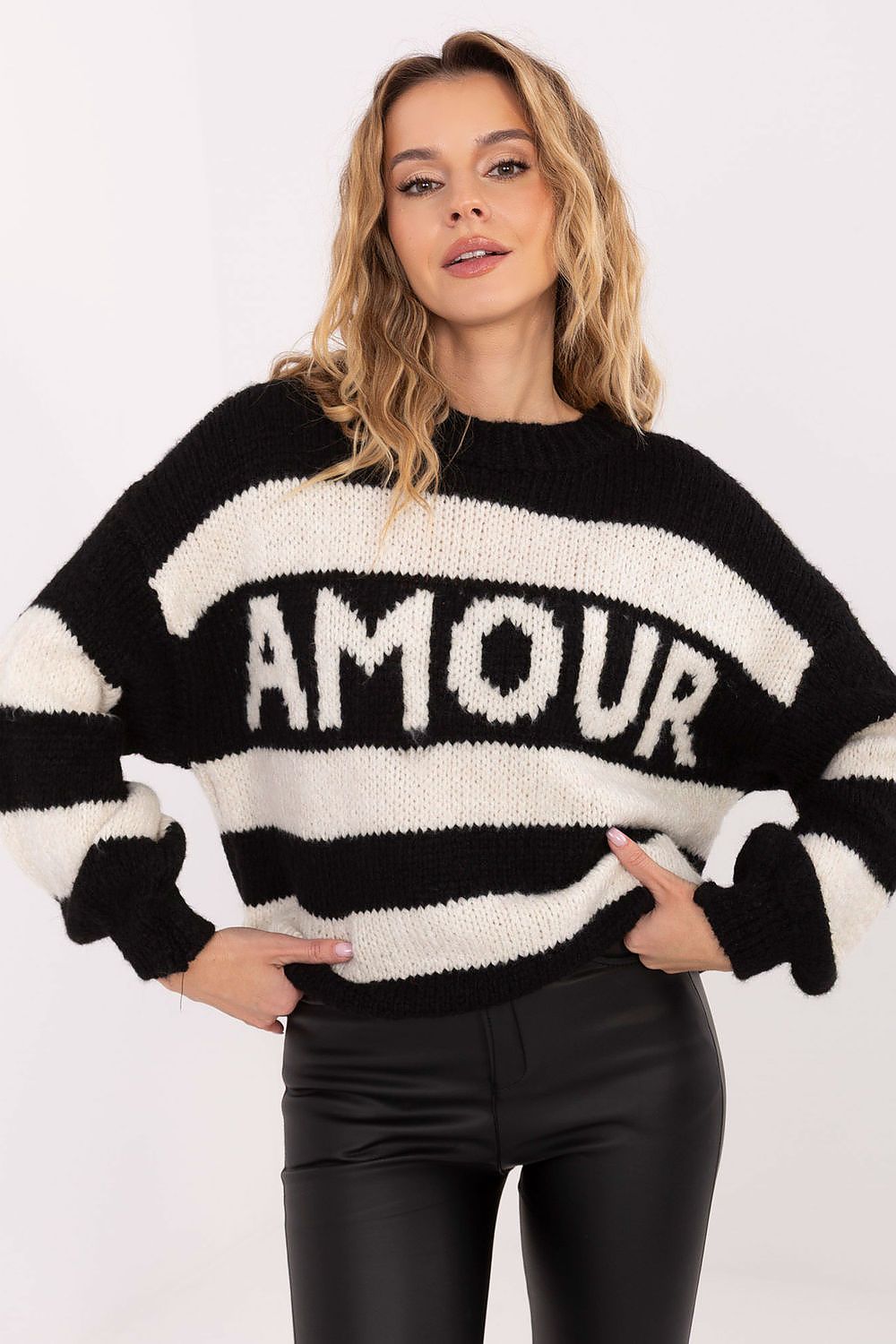  Close-up of sweater fabric showing soft texture.