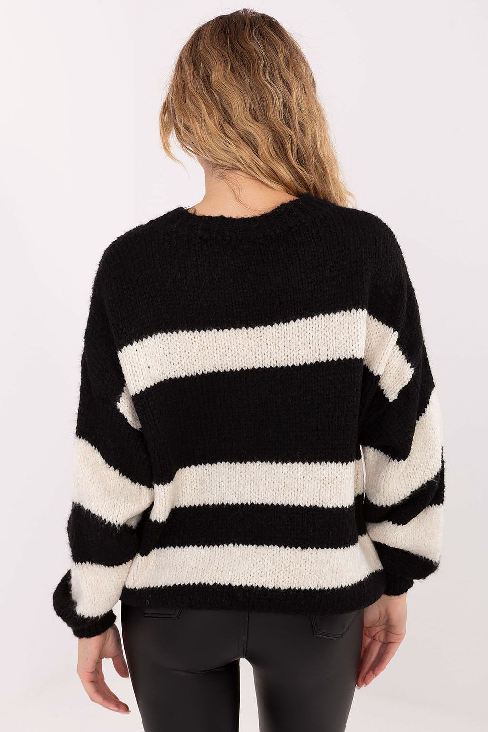  Styled outfit featuring sweater with casual pants.