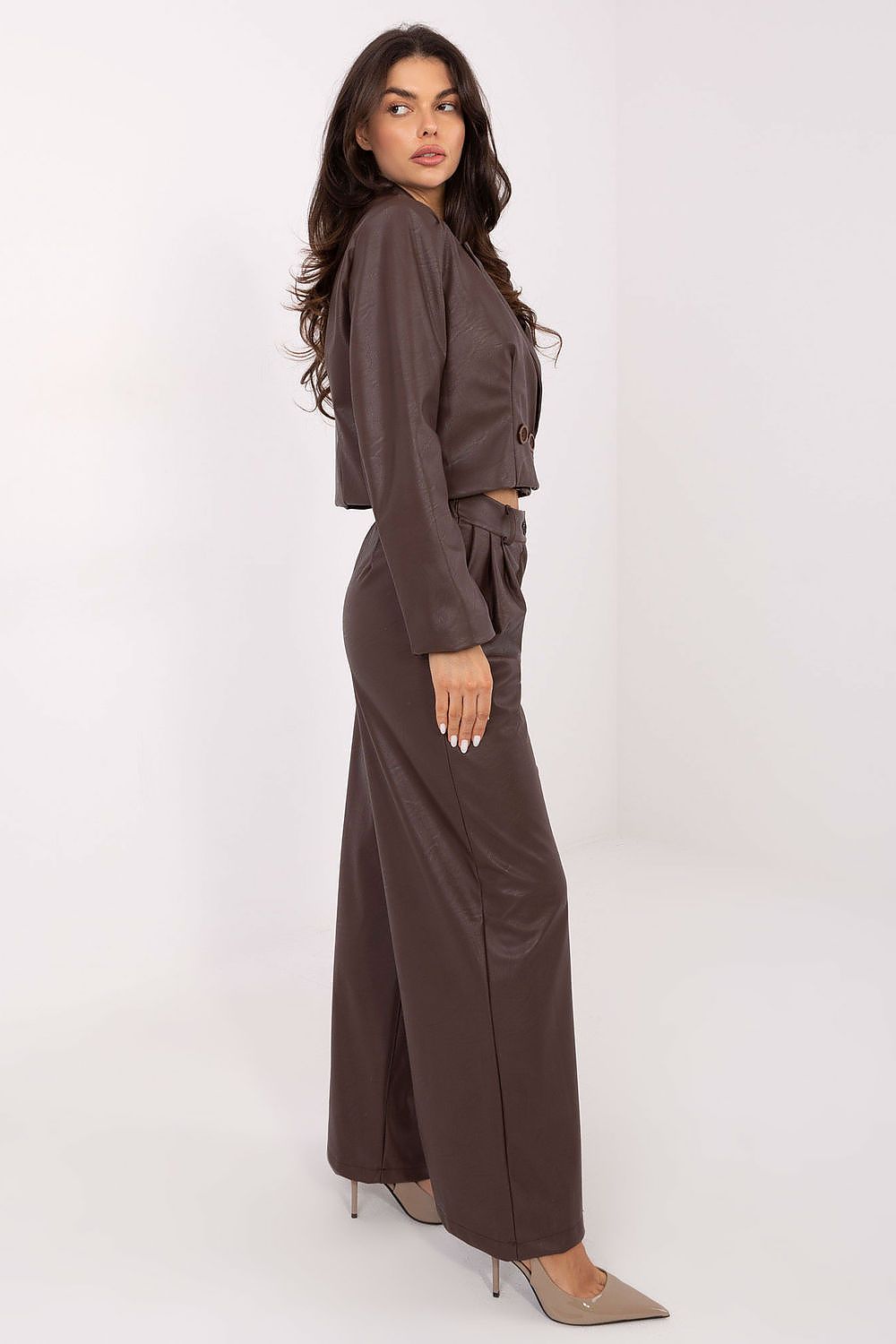  Side view showing shoulder pads and tailored silhouette.