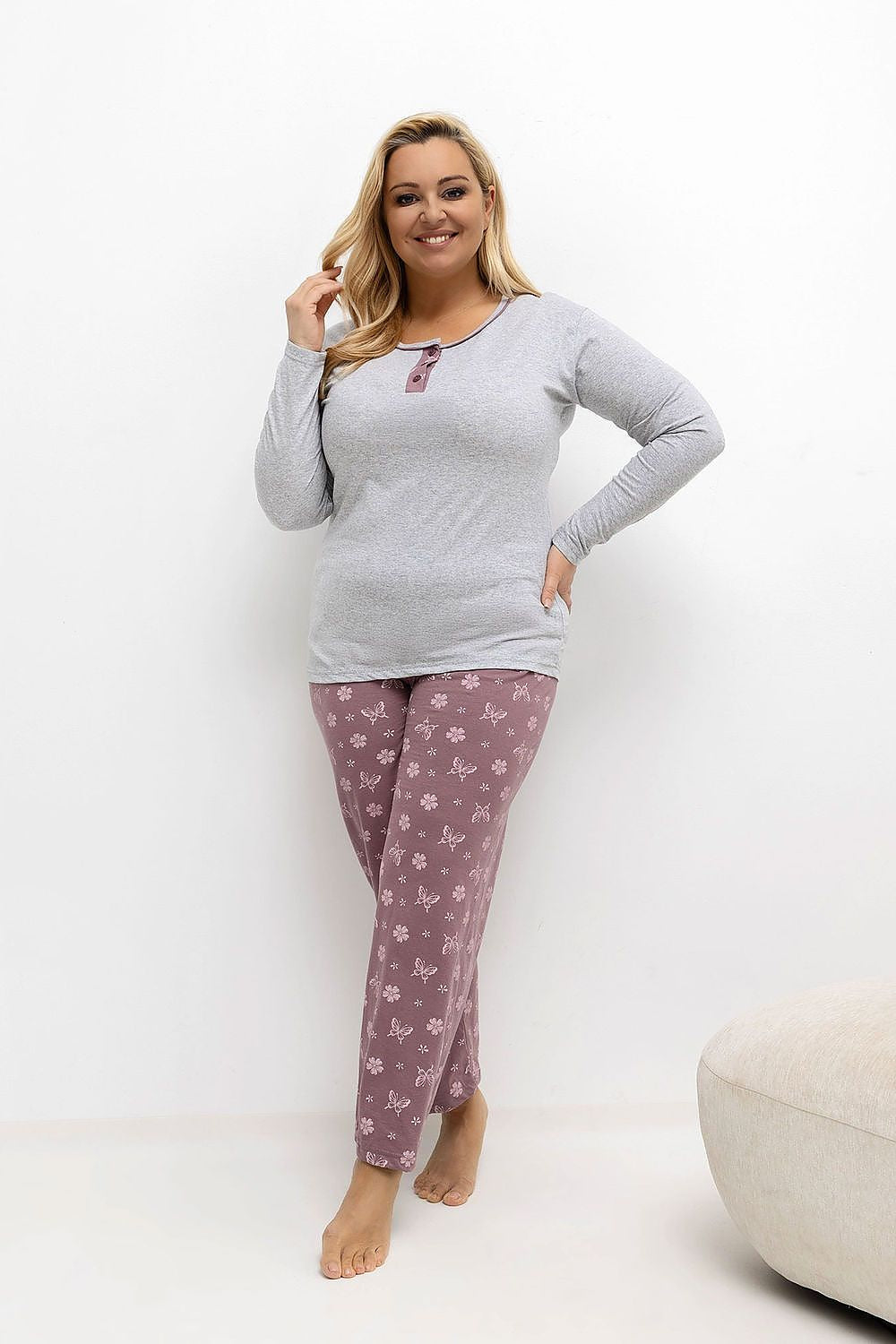 Front View: Model in the grey pyjama set, showing the long sleeves, round neckline, and the elastic waistband on the pants with floral and butterfly print.