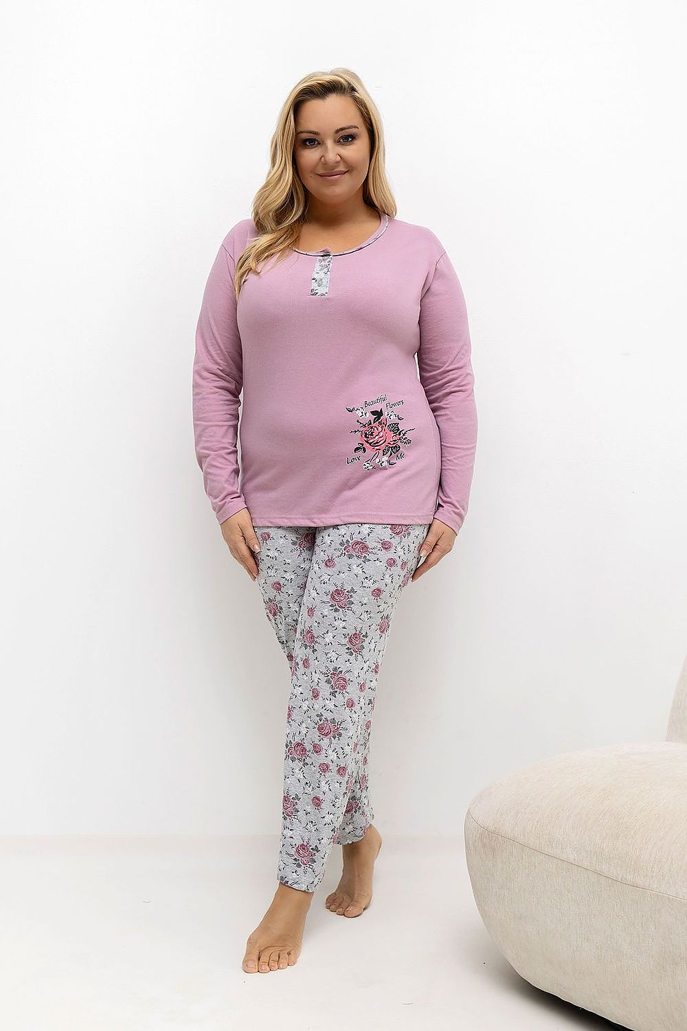  Front View: Model wearing the pink pyjama set, standing relaxed to highlight the button panel, round neckline, and flower print on the top, paired with floral pants.