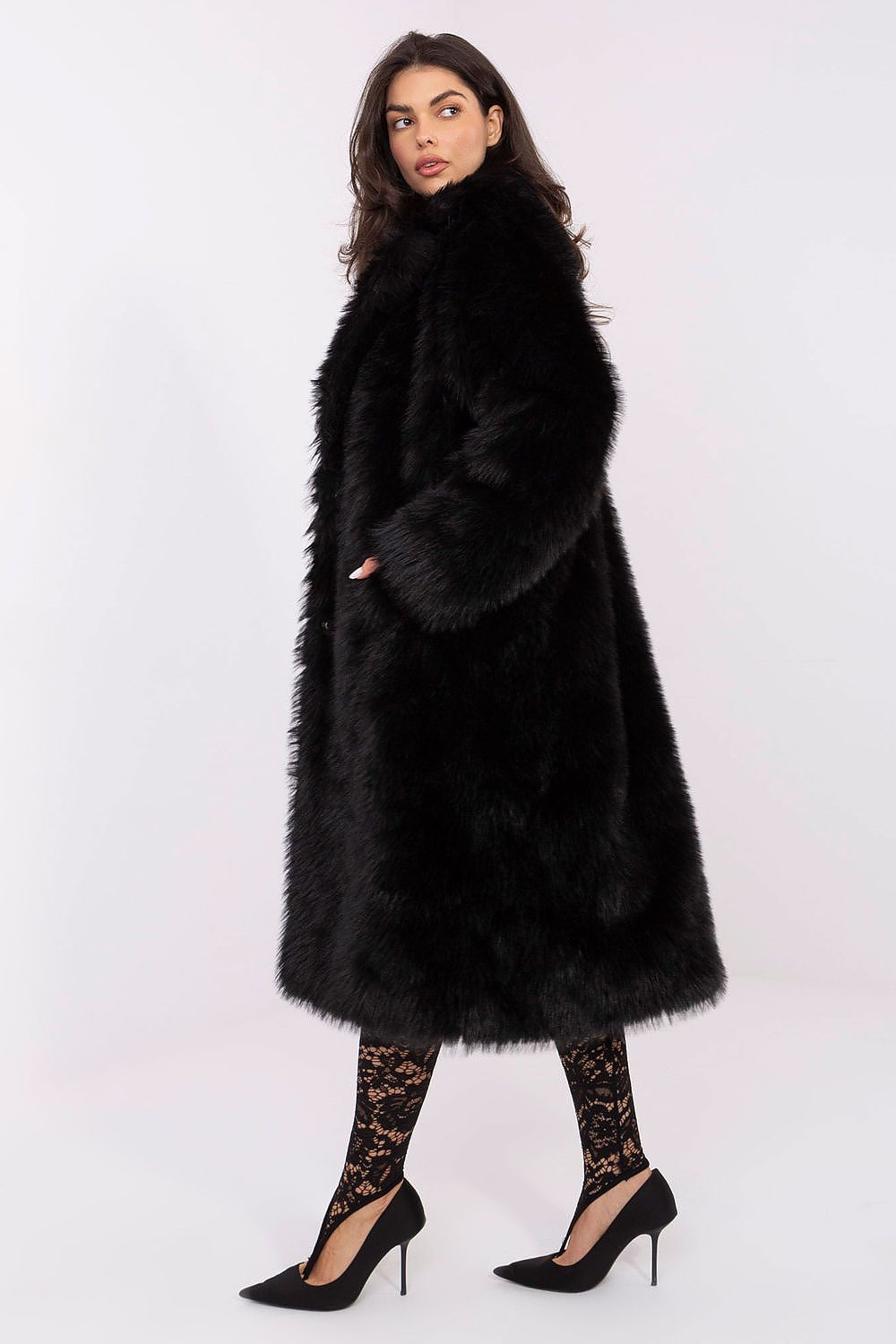 Woman wearing a black fur coat on a white background