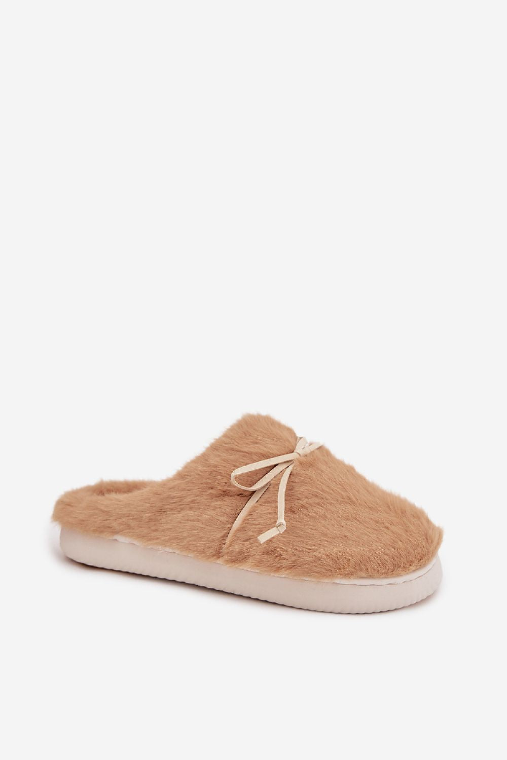 Beige fuzzy slipper with a white sole on a light beige background