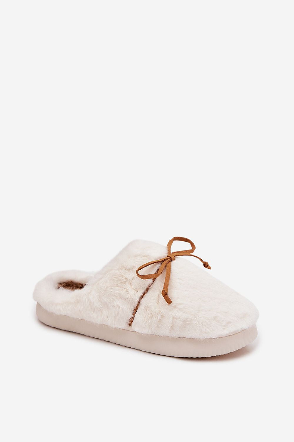 White slipper with brown bow on a white background