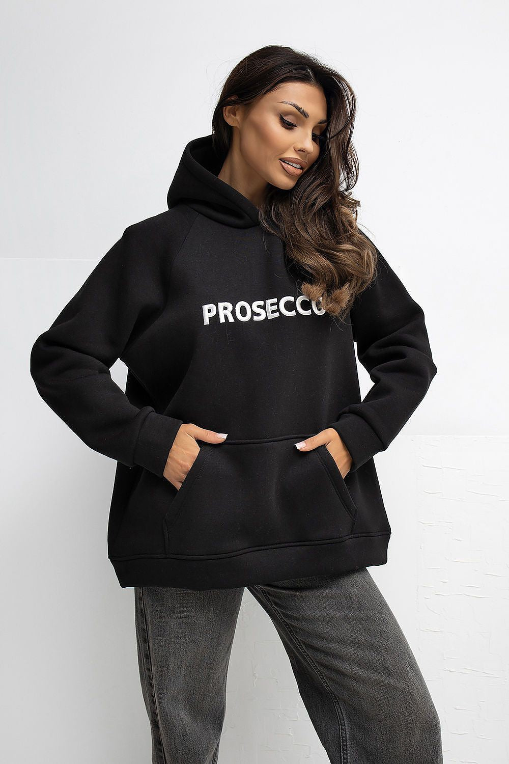  Black women’s sweatshirt with hood and embroidered lettering.