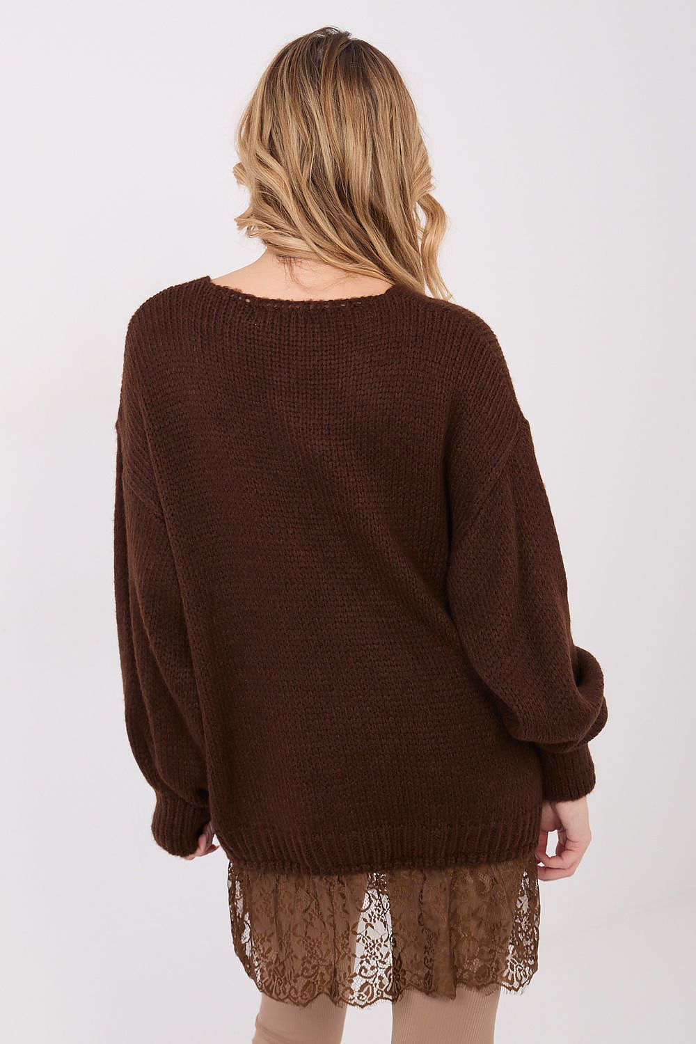 Brown sweater worn by a person on a white background