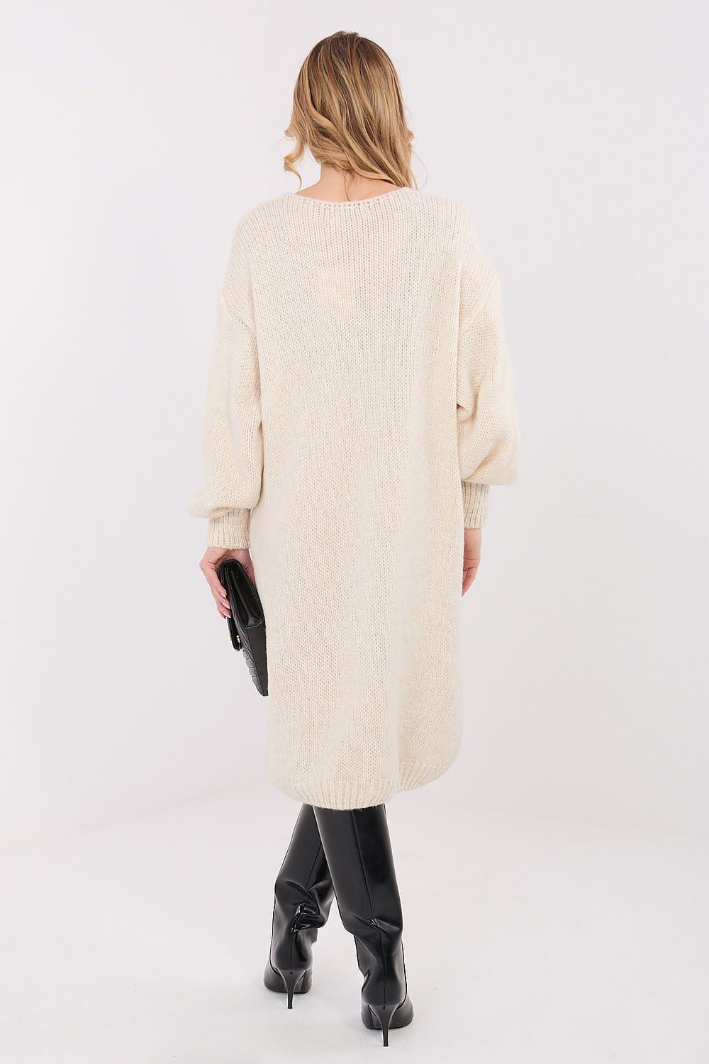  Beige loose-fit knit sweater dress showing relaxed side silhouette.