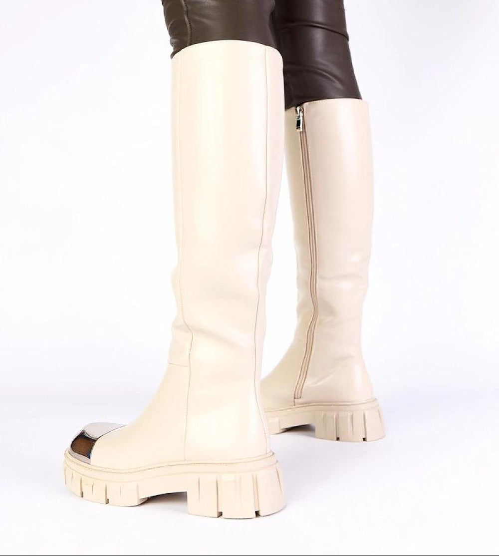 White knee-high boots on a white background