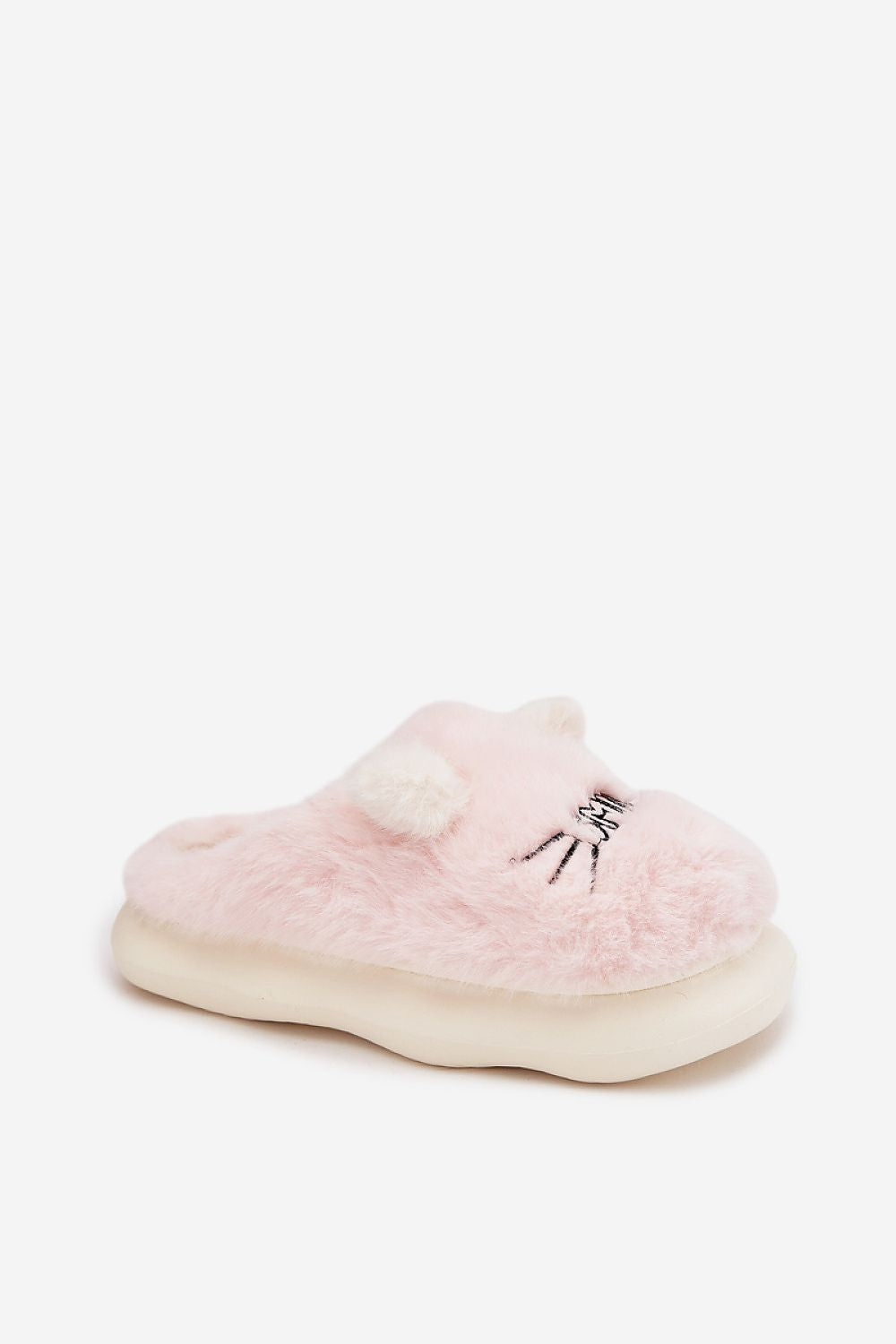 Pink fuzzy slippers with a bow on a white background