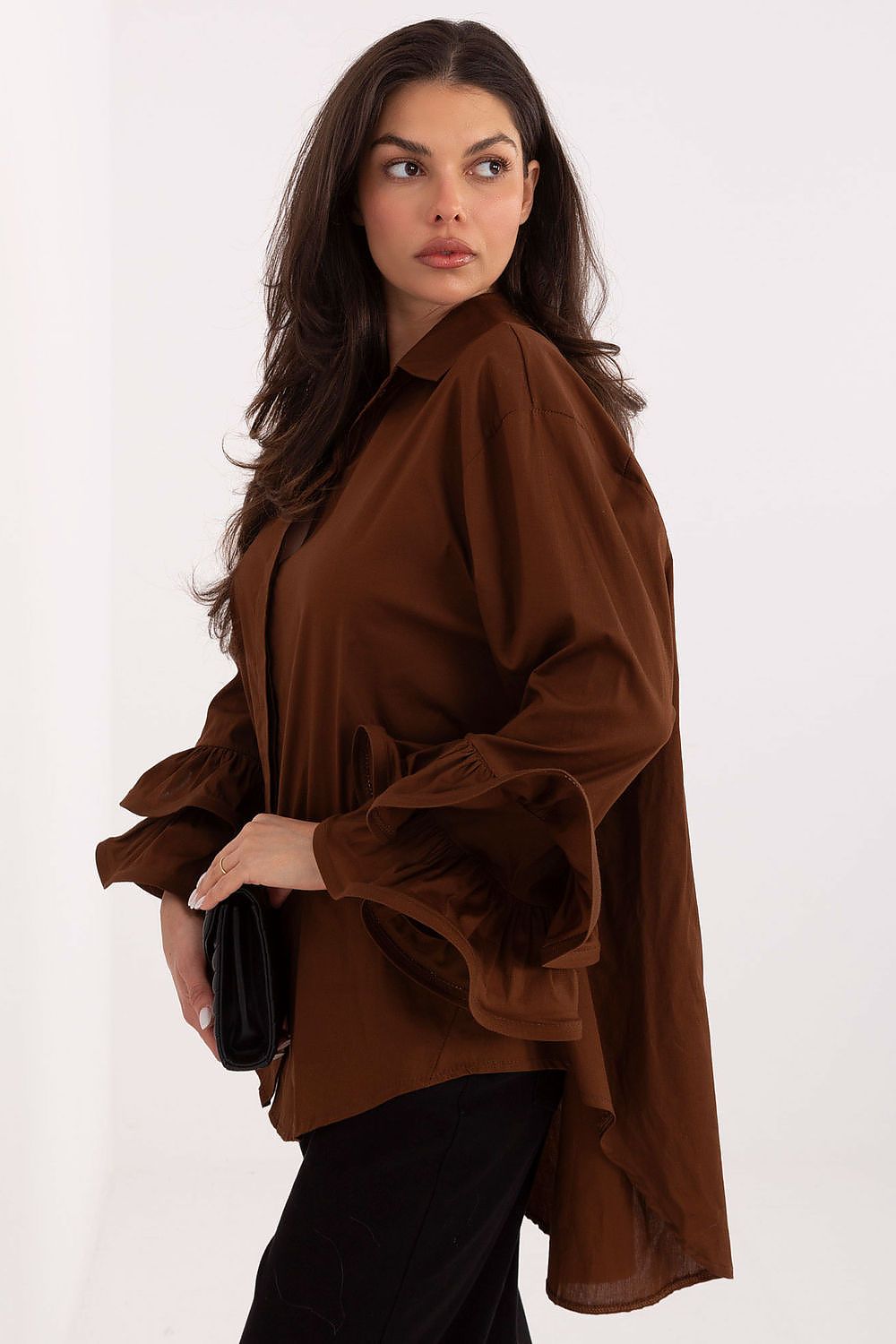  shirt with button fastening and feminine ruffle sleeve detail – side angle.