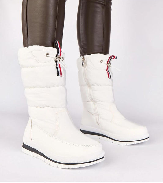 White winter boots with red and black accents on a white background