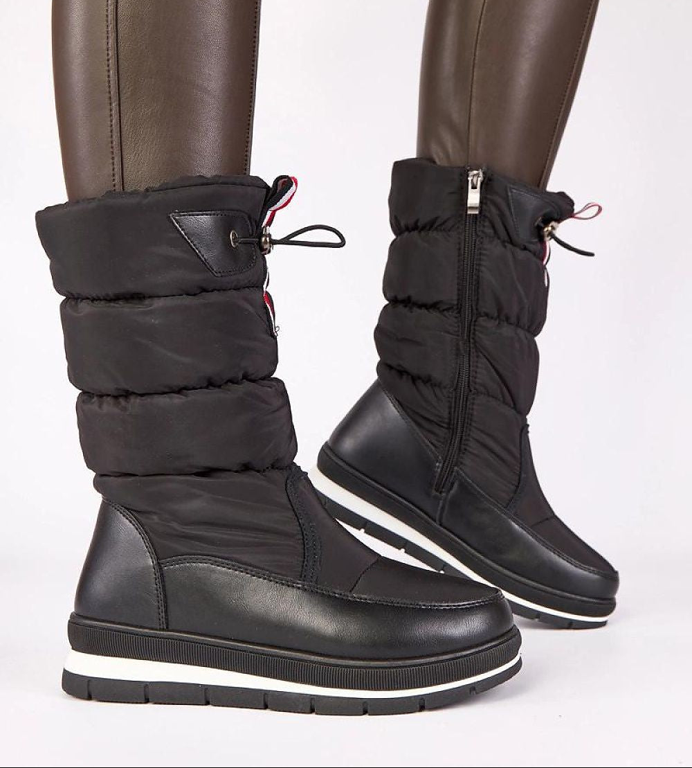Black winter boots with quilted design on a white background