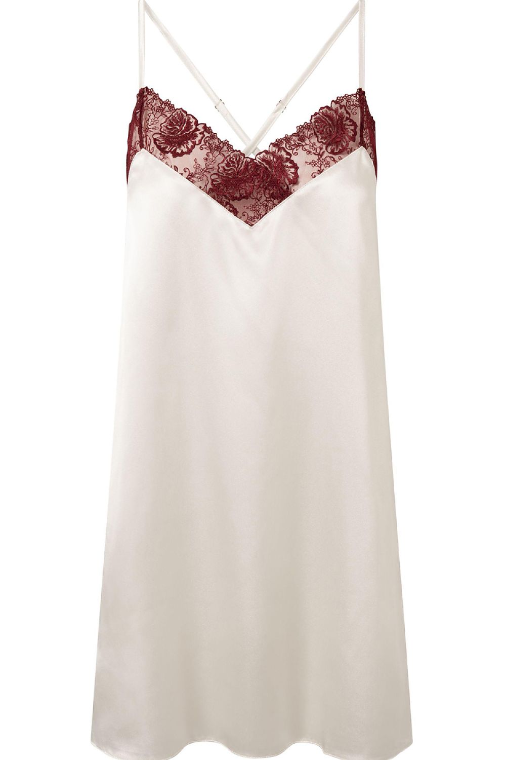 White slip dress with red lace details on a white background