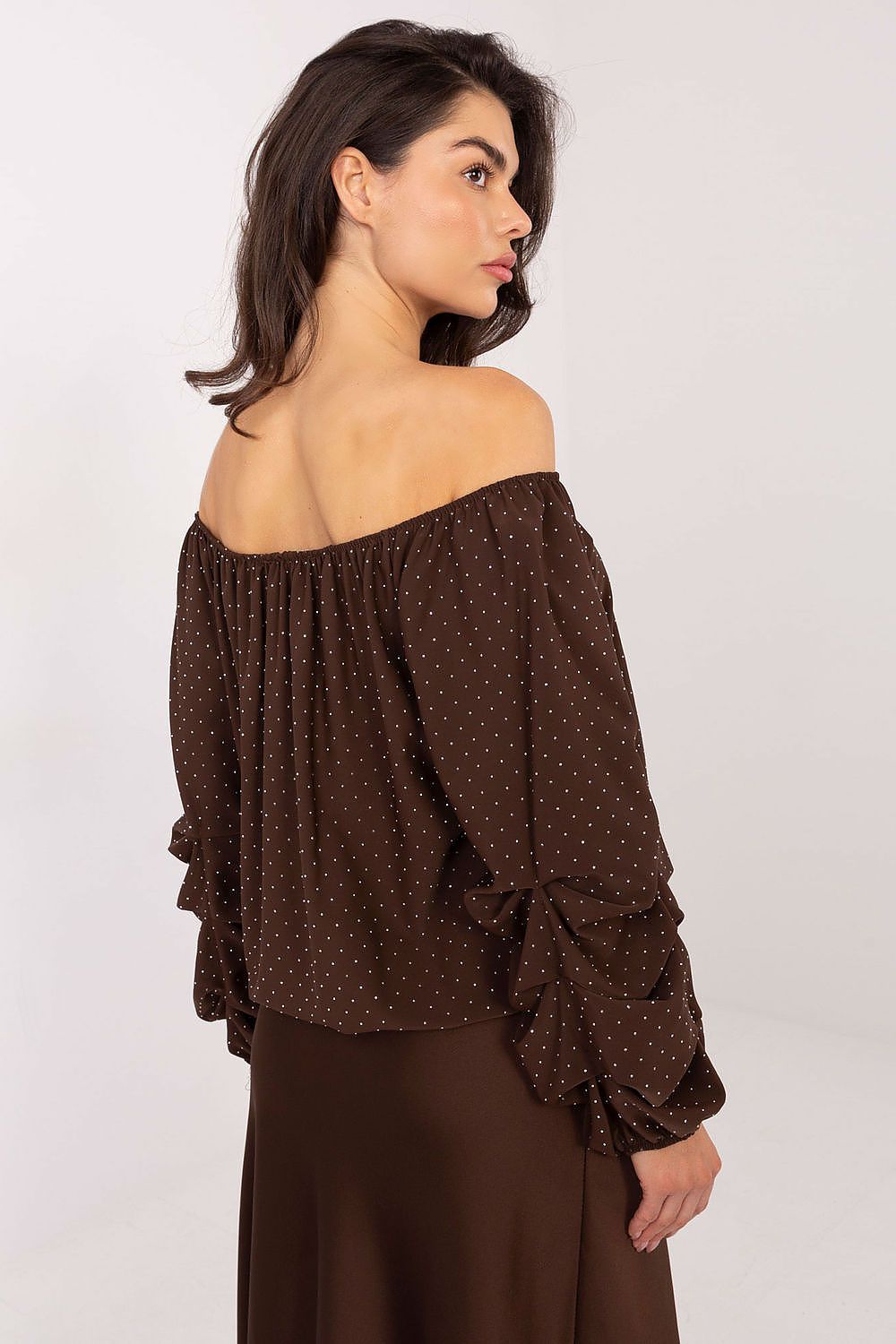 Side view of brown viscose blouse showing neckline and sleeve details