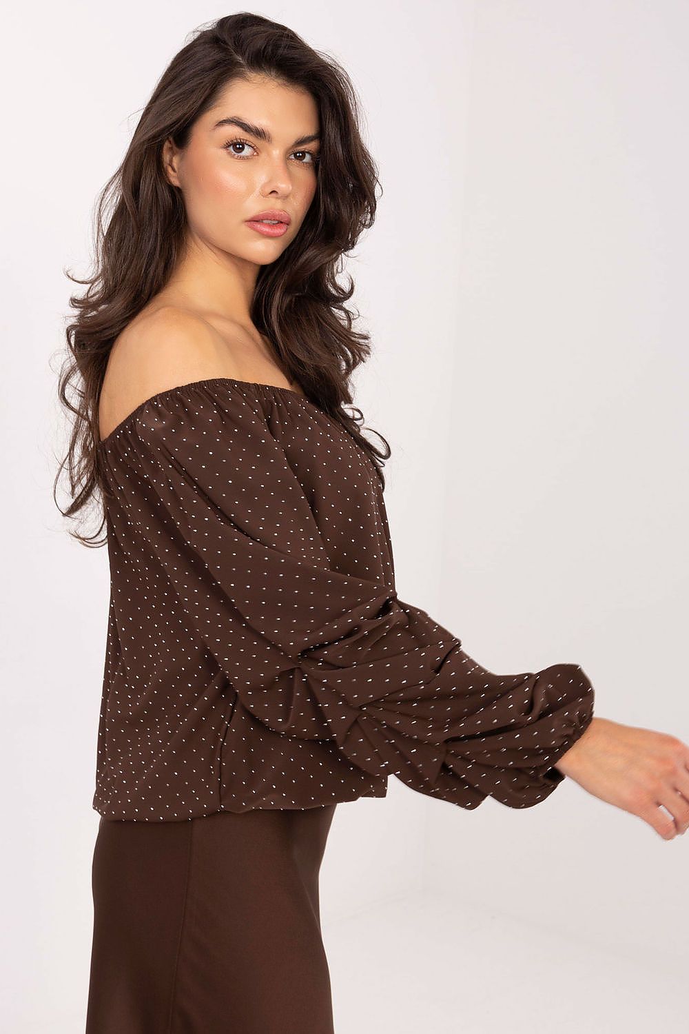Side view-2 of brown viscose blouse showing neckline and sleeve details